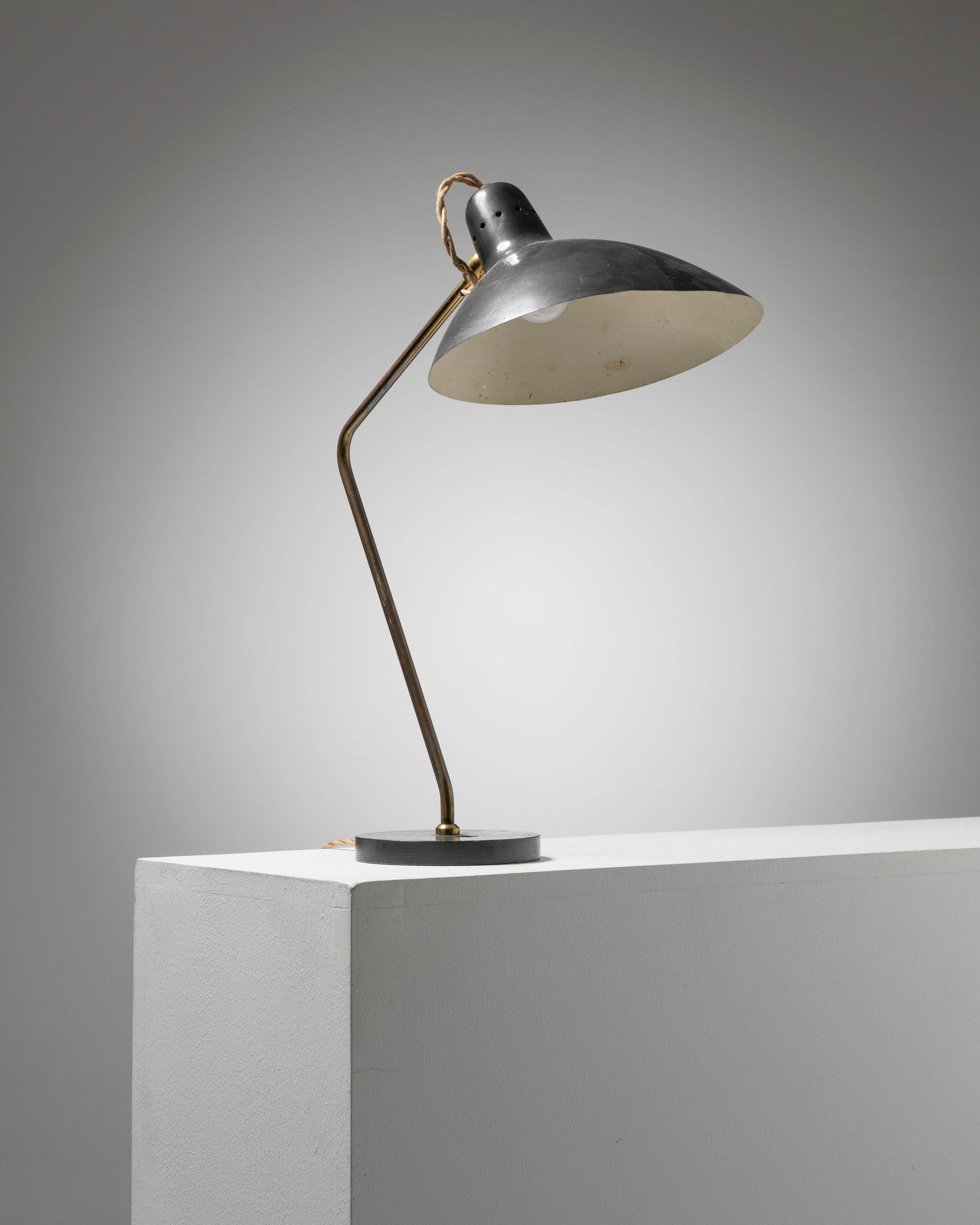 Desk lamp, Caillat edition by Jean-Boris Lacroix (1902–1984), 1960s.
Metal and brass structure. A slight dent is visible on the reflector, along with a few minor chips, but overall in good vintage condition. Original functional wiring, European