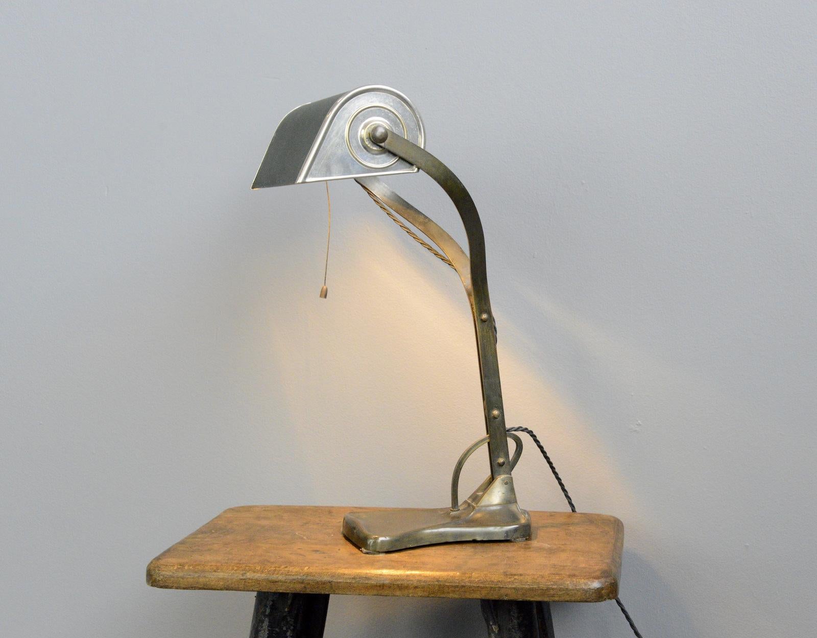 Desk lamp by Robert Pfaffle for Erpees, circa 1920

- Articulated arm and shade
- Copper with olive green shade
- Pull cord on/off switch
- Takes E27 fitting bulbs
- German, circa 1920
- Measures: 45cm tall x 23cm wide x 19cm