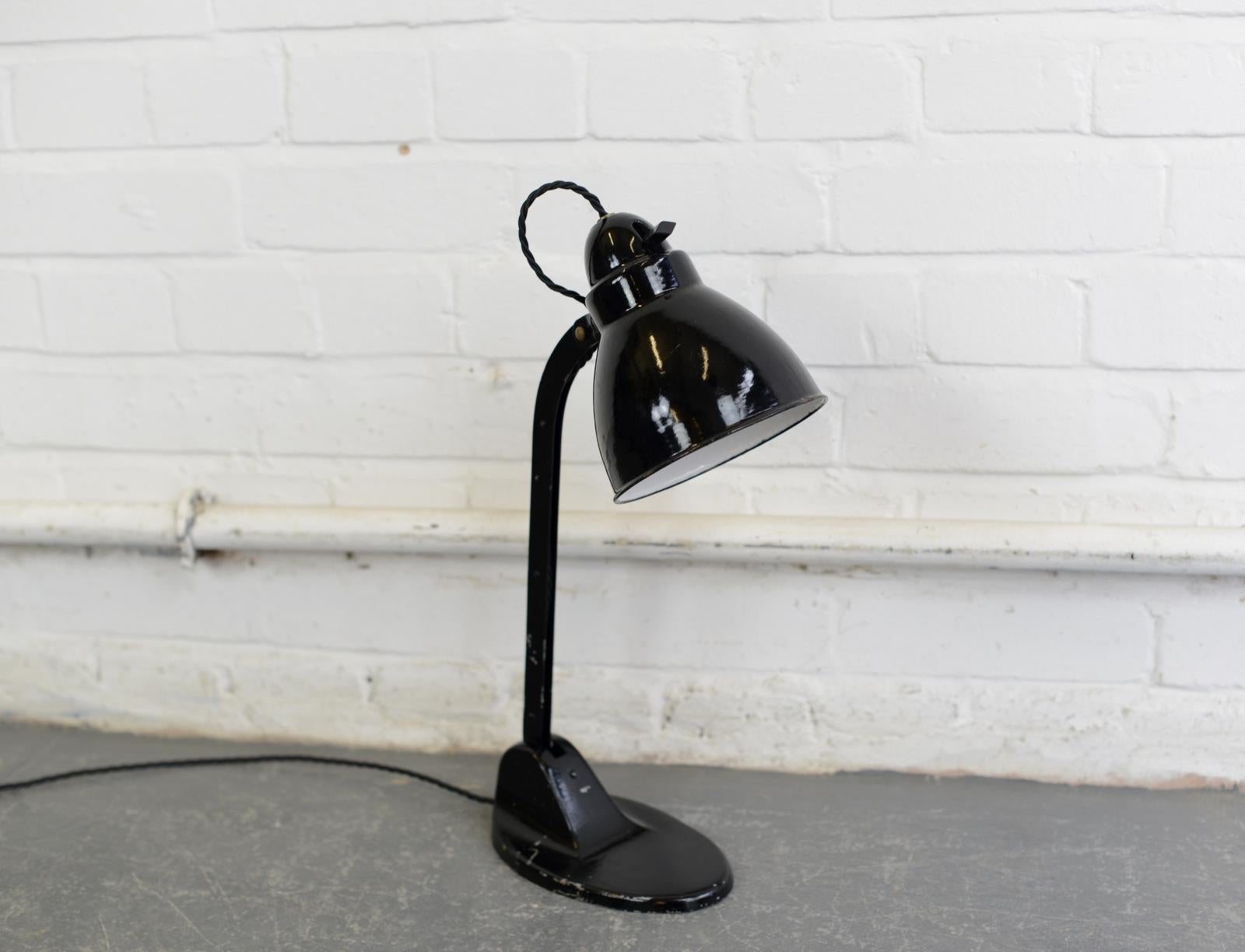 Desk lamp by Viktoria, circa 1930s.

- Vitreous enamel shade
- Adjustable arm and shade
- Cast iron base
- Takes E27 fitting bulbs
- Original bulb holder and switch
- Embossed Viktoria Lampe on the base
- German, 1930s.
- Measures: 46 cm