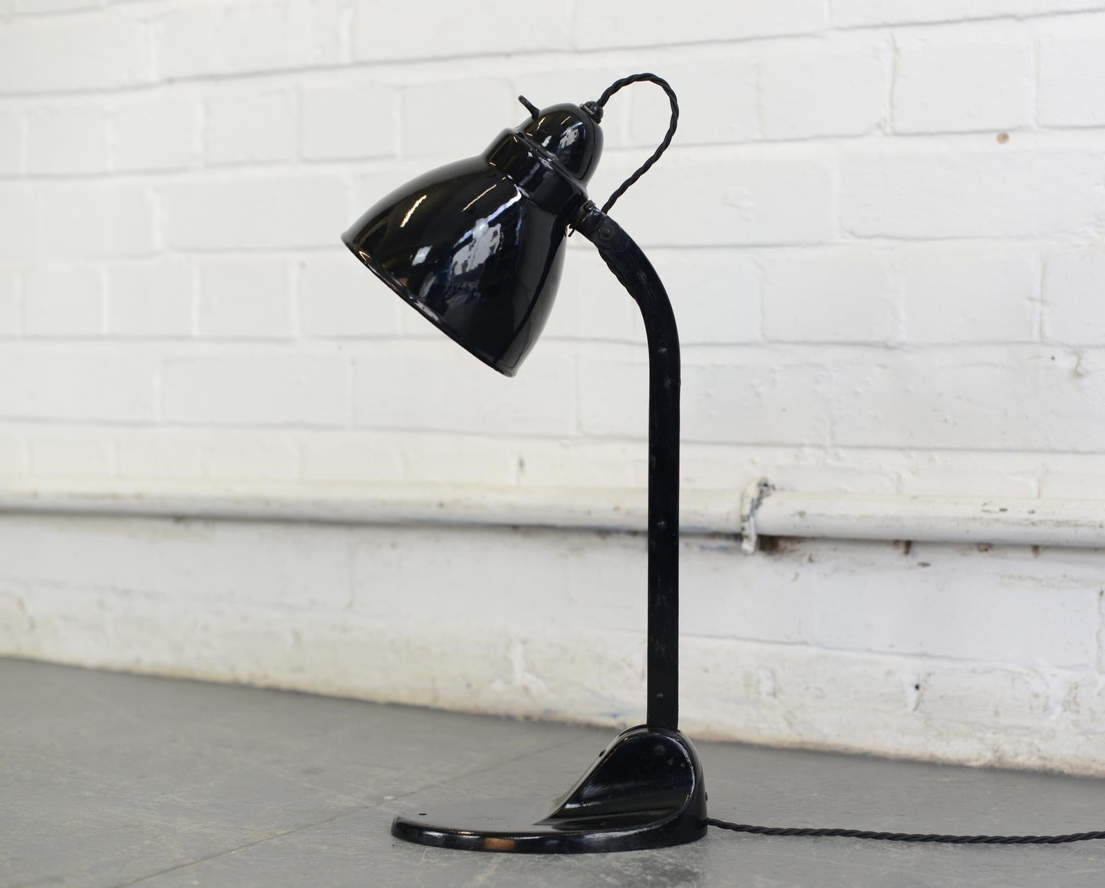 Desk lamp by Viktoria, circa 1930s.

- Vitreous enamel shade
- Adjustable arm and shade
- Cast iron base
- Takes E27 fitting bulbs
- Original bulb holder and switch
- Embossed Viktoria Lampe on the base
- German, 1930s
- Measures: 46cm tall