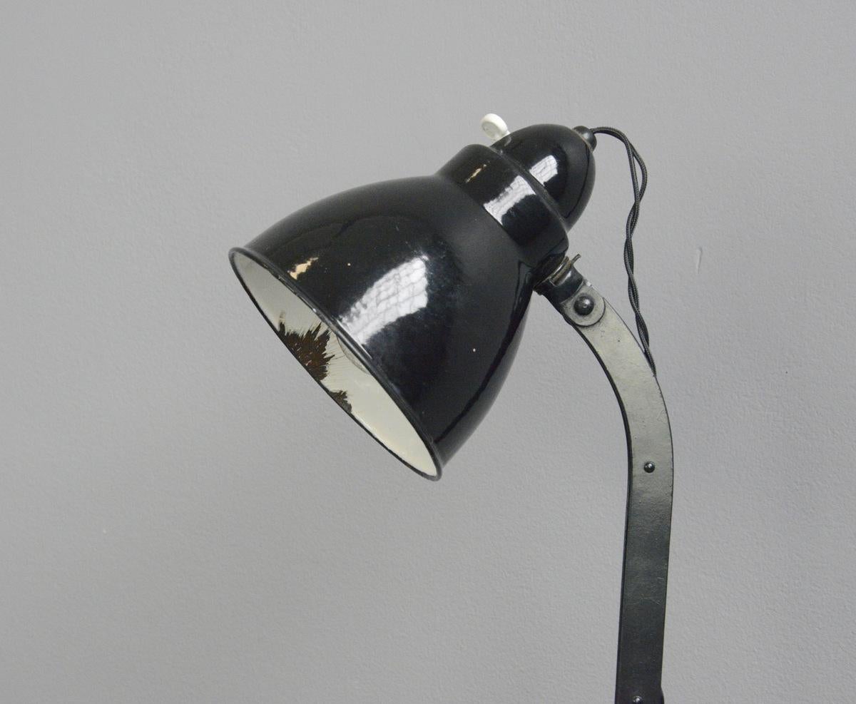 Desk lamp by Viktoria, circa 1930s

- Vitreous enamel shade
- Adjustable arm and shade
- Cast iron base
- Takes E27 fitting bulbs
- Original bulb holder and switch
- Embossed Viktoria Lampe on the base
- German, 1930s
- Measures: 46cm tall