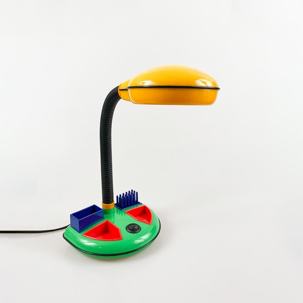 Desk lamp design by Kyoji Tanaka for Rabbit Tanaka Corp, Ltd. 1980's

Plastic in primary colors. Base with desktop organizer.

Bulb E14 Max. 40w european cord.

Measurements: 35x28x19.