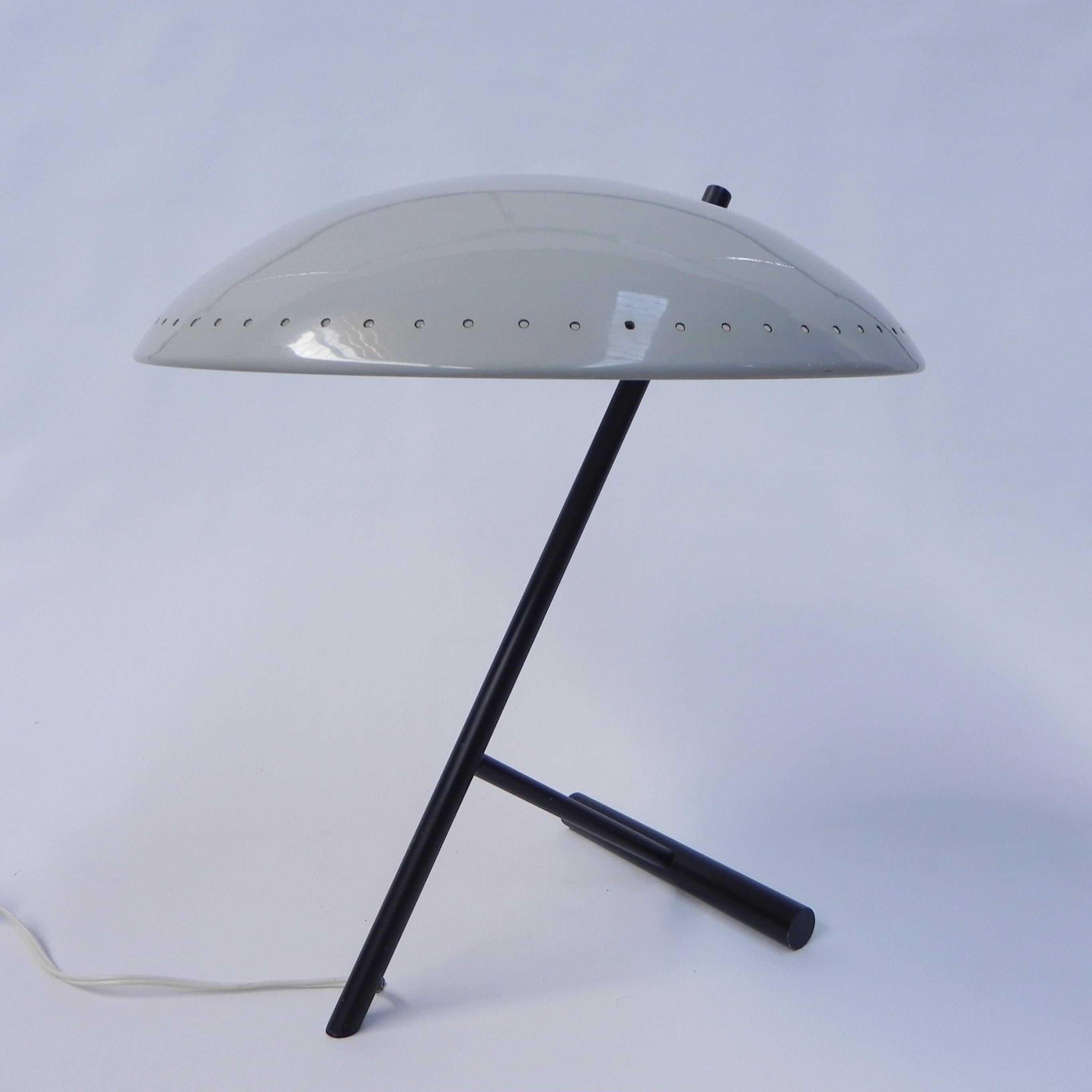 Height: 43 cm.
Ø: 39 cm.
The lamp is equipped with a large bulb holder (E27).
Origin: The Netherlands, 1960s.
Material: aluminum (shade) / brass (painted black).
All our lamps are suitable for LED lamps.