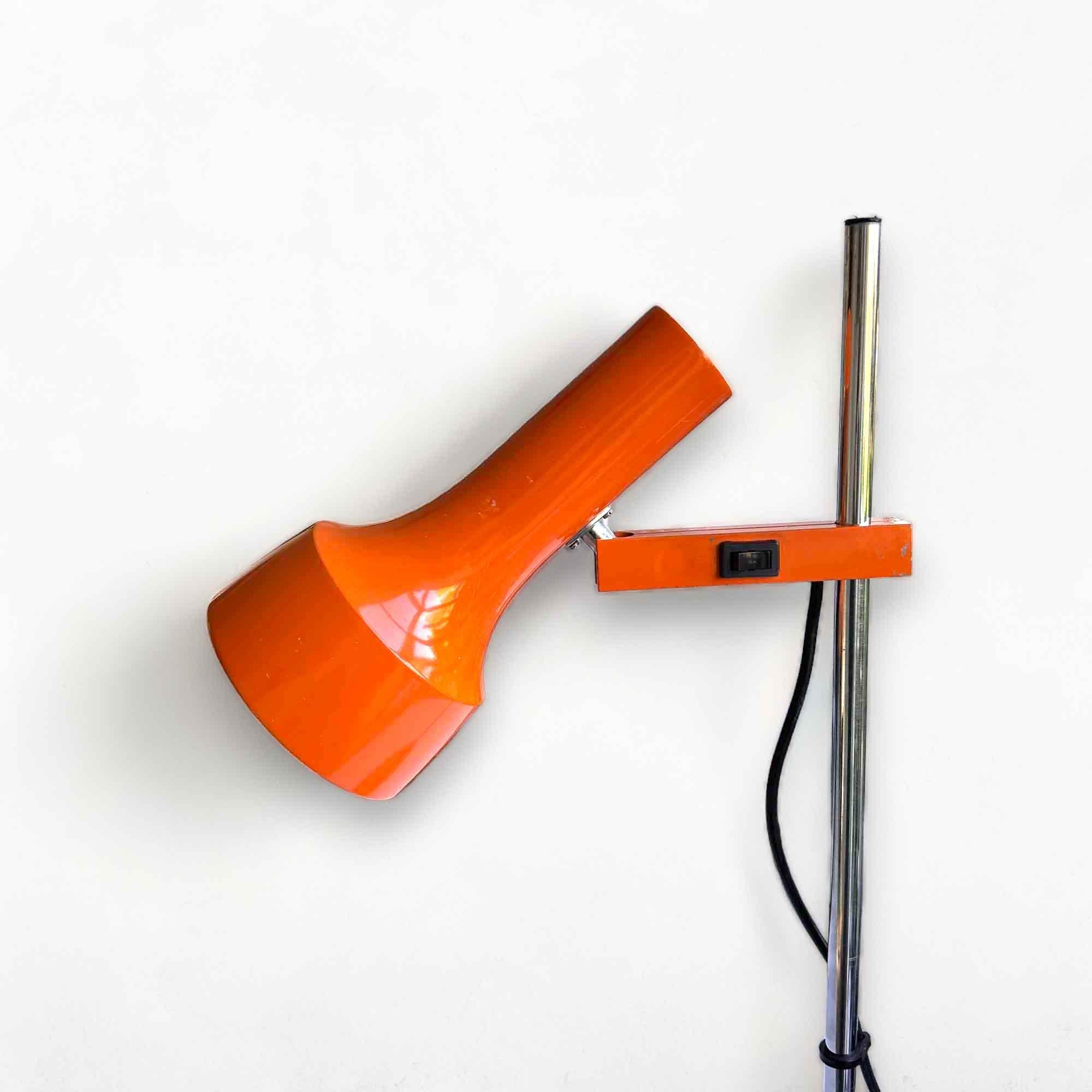 Orange space-age desk lamp from Kaiser Leuchten. This lamp can be adjusted in height and the shade can rotate, ensuring optimal light. The shade and base show light wear & tear. The chrome is in good condition. The lamp has been rewired.

Germany,