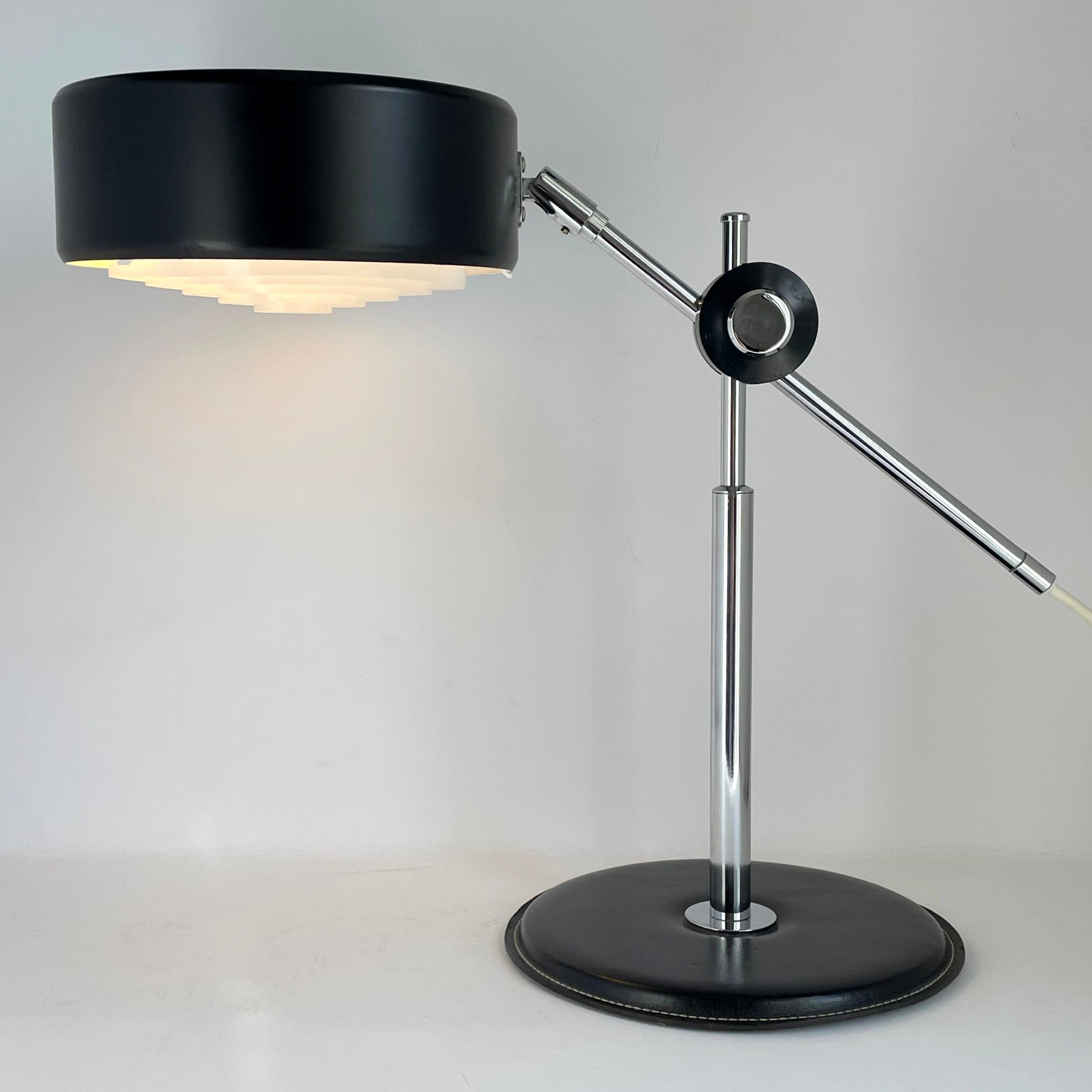 A desk lamp designed by Anders Pehrson for Atelje Lyktan in the early 1970s. Adjustable in all directions. Two lamp holders for  25 W and 40 W witch make it possible to have three different luminosity; 25, 40 and 65 W. The foot base has a black