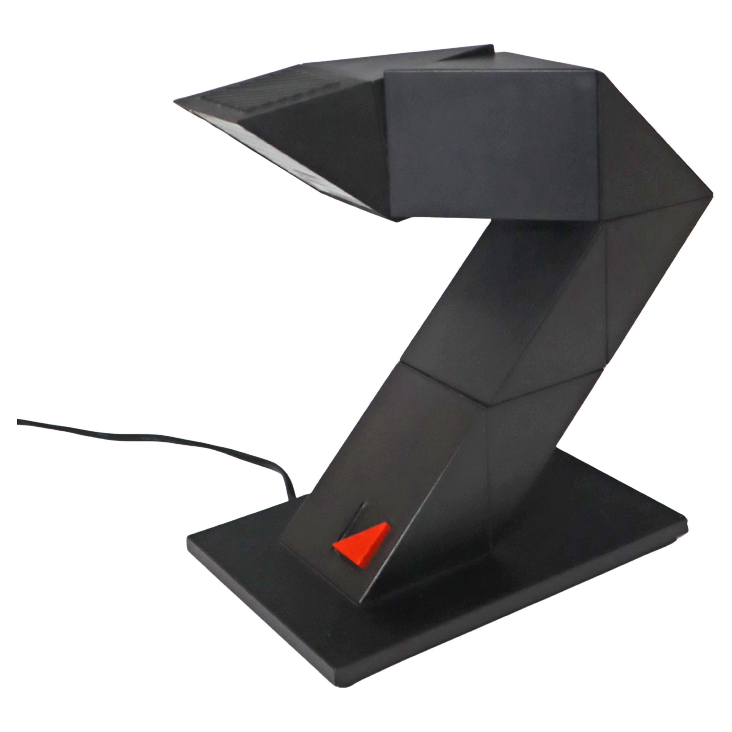 I present to you a very facinating design of Zig Zag table lamp by Brilliant from the 1980s. This zig zag lamp is an iconic one which combines both functionality and style. It brings out a touch of vintage charm to your room due to its design which