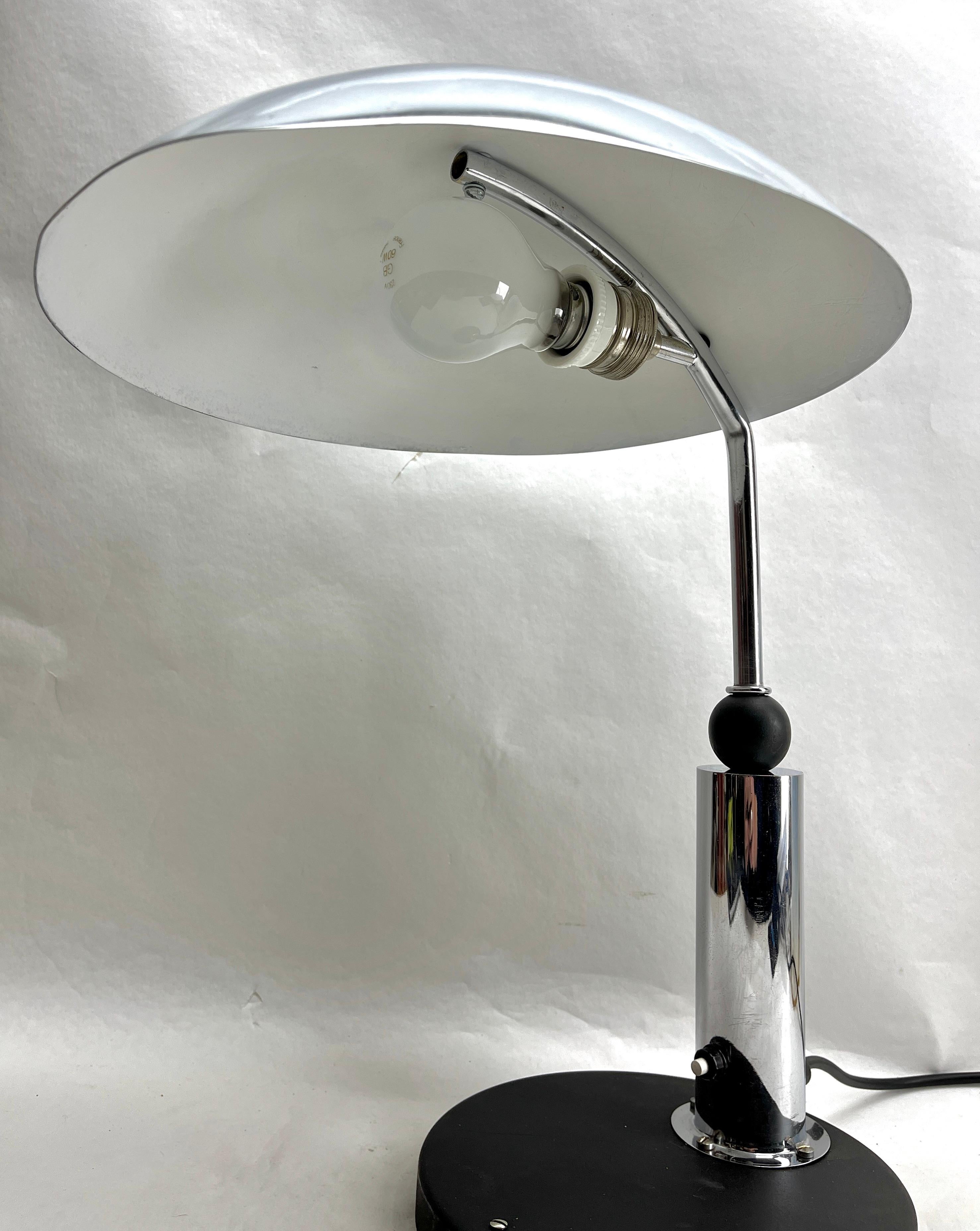 Desk or Side Table Lamp KMD (Daalderop) Tiel in Bauhaus style 1930s
This original, period Aerly Century Desk lamp was designed by KMD, 
Desk or Side Table Lamp Tiel Netherlands
Bauhaus style, with a chrome hood and stand and a black enamelled base