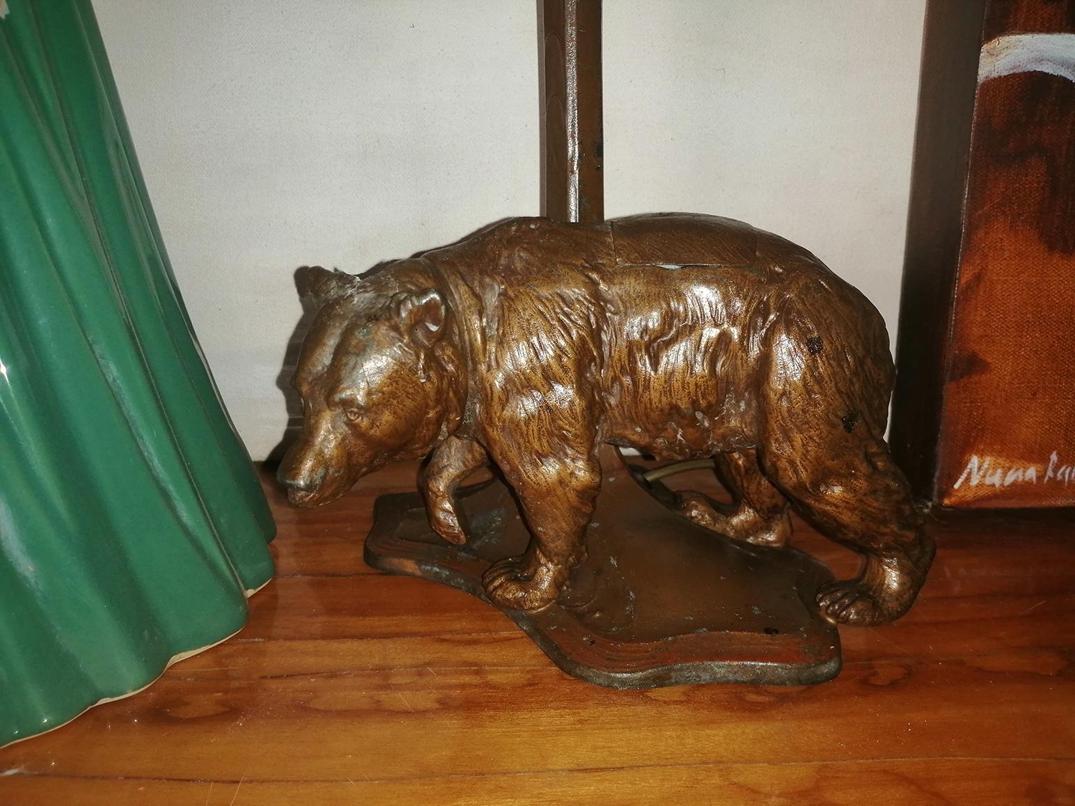 Art Deco / Art Nouveau desk or table lamp with a figure of a bear with an interior hole for ink or other uses,

Late 19th or early 20th century.

With all the characteristics of vintage lamps, but with the added uniqueness of that precious bear