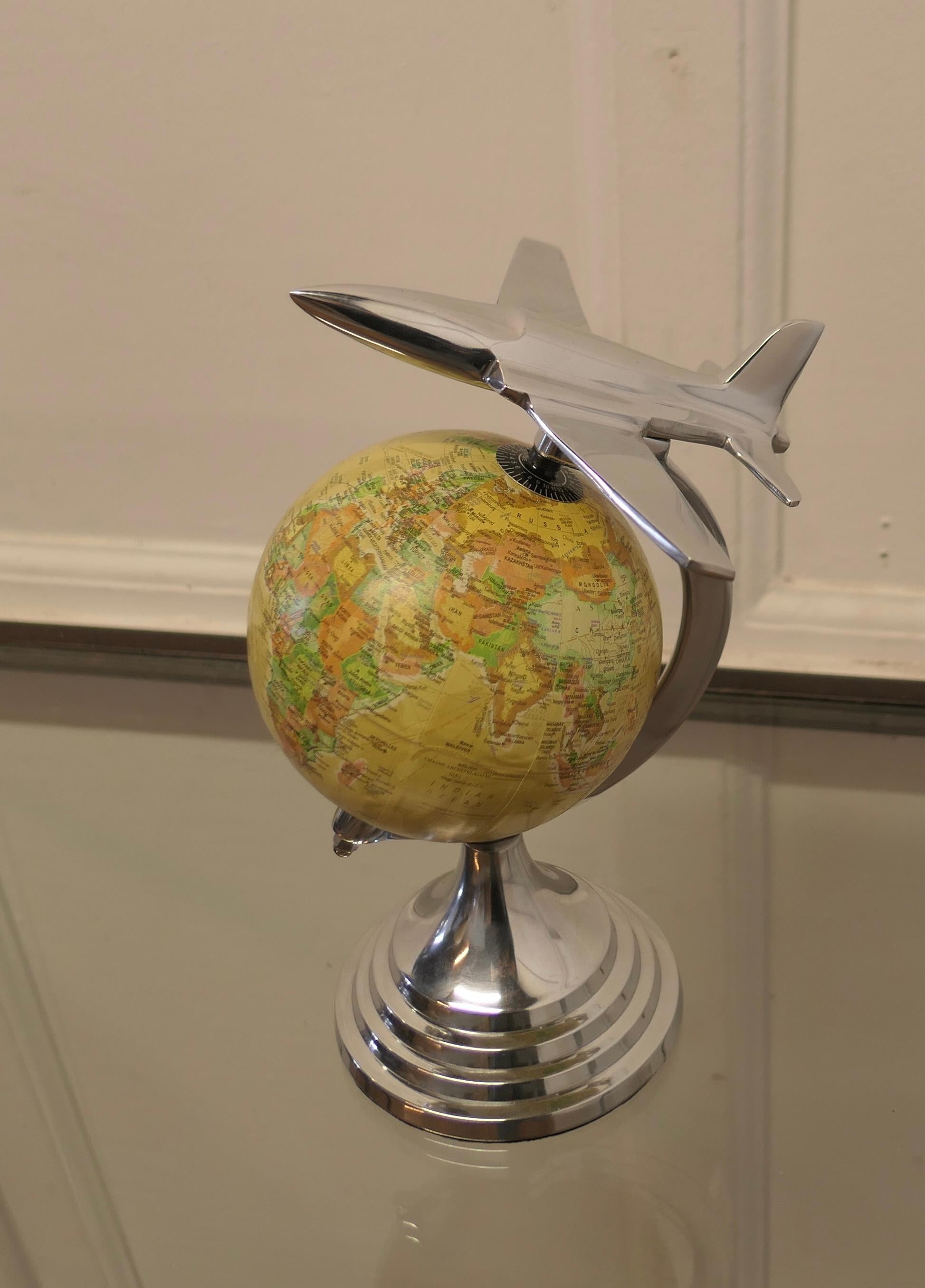  Desk Ornament World Globe with Chrome Model Aeroplane

A super piece and a great desk ornament for the desk that has everything else 
This small globe is set on a chrome stand beneath the superb flight angle of the plane , in very good condition a