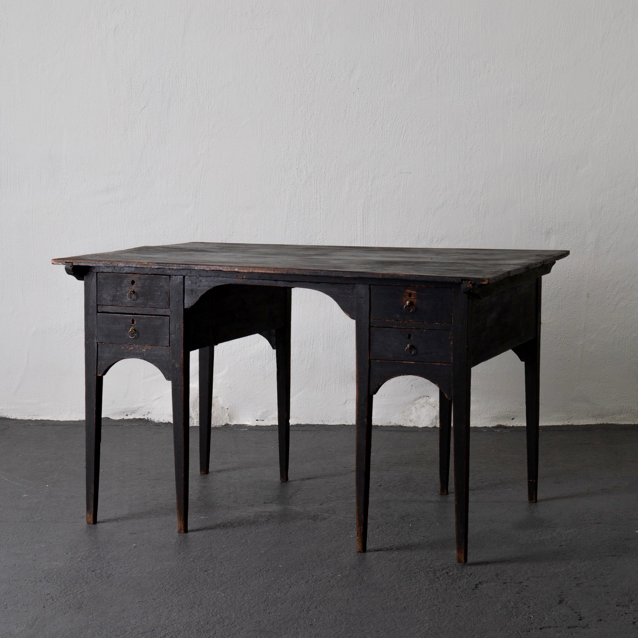 Desk partner Swedish Gustavian black Sweden. A partners desk made during the Gustavian period in Sweden. Painted in our Laserow black. Brass hardware on the eight drawers, four on each side. Square legs tapered. Height from floor to apron: