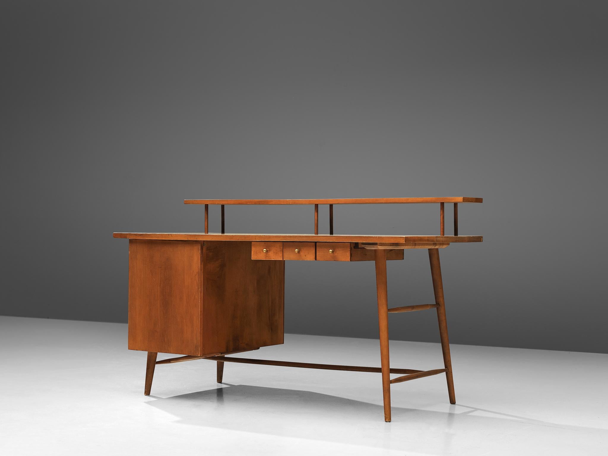 Paul McCobb for Winchendom Furniture Company, desk, maple, United States, 1950s

Elegant maple desk with one sided pedestal with a large storage compartment and three small drawers on the other side. The desk is executed with slender legs,