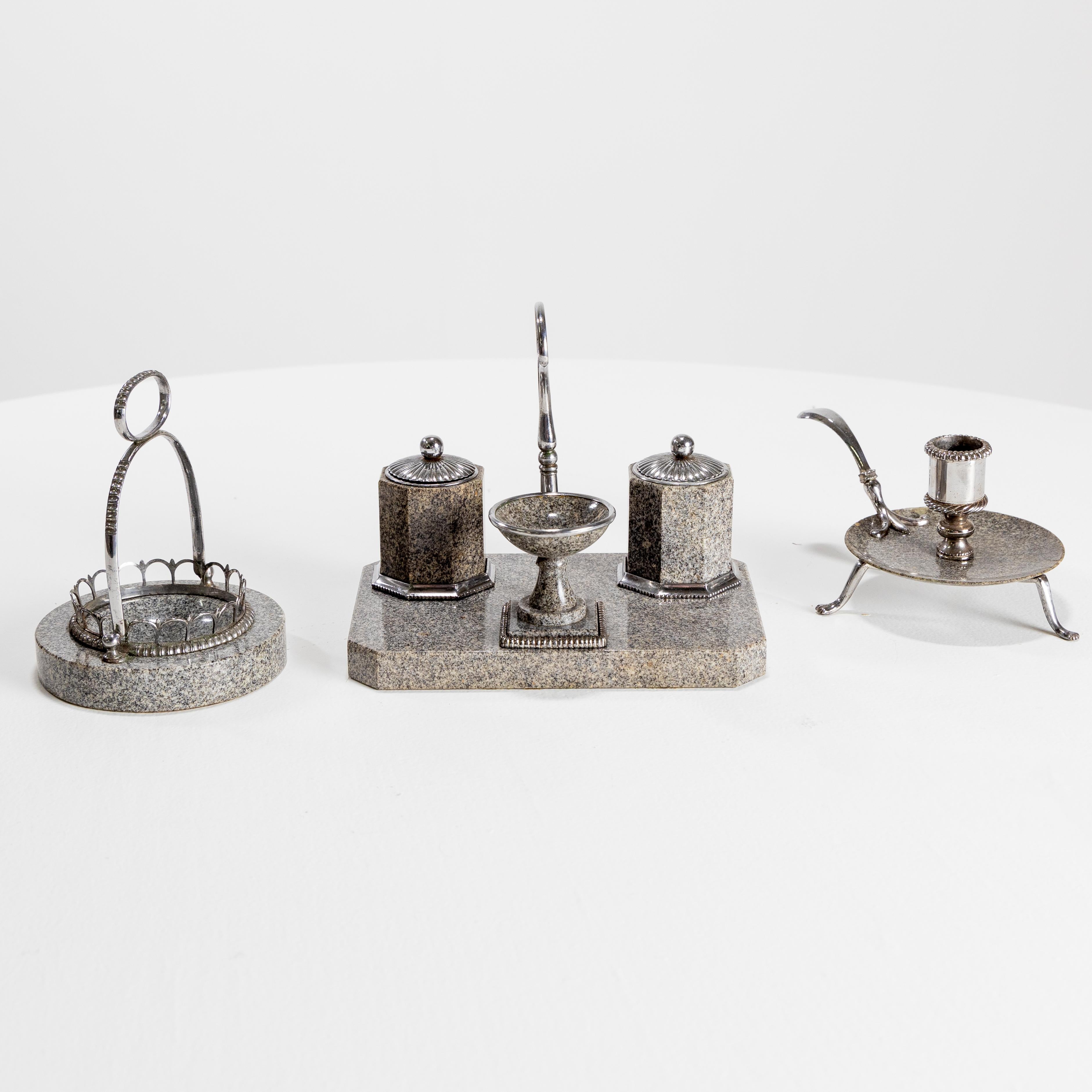Seven-piece desk set from Vienna in granite with polished steel mounts.