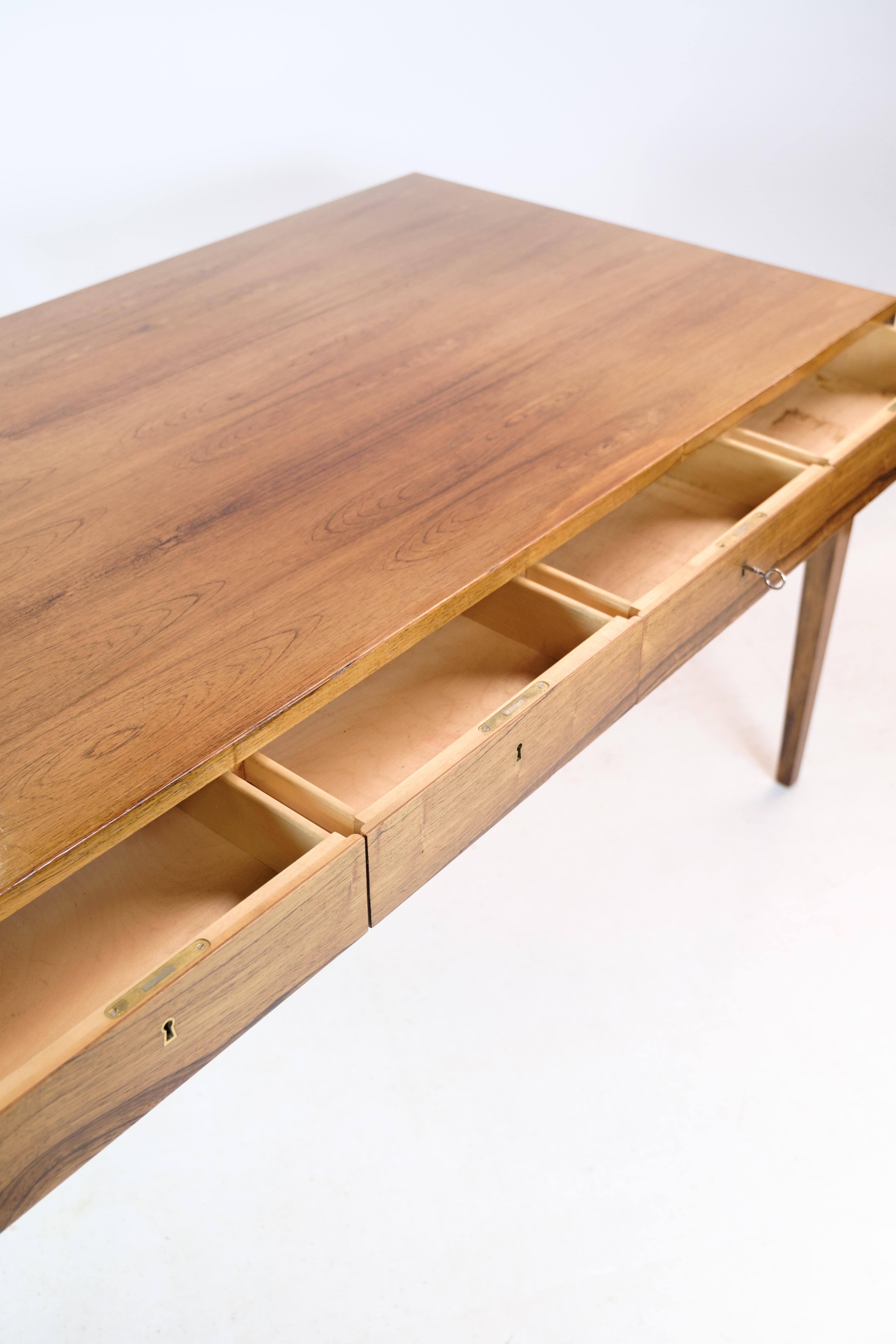 Freestanding desk, designed by Severin Hansen in rosewood manufactured at Haslev Møbelfabrik from around the 1960s. Keys included. The desk has 4 drawers and brass keyholes.

This product will be inspected thoroughly at our professional workshop