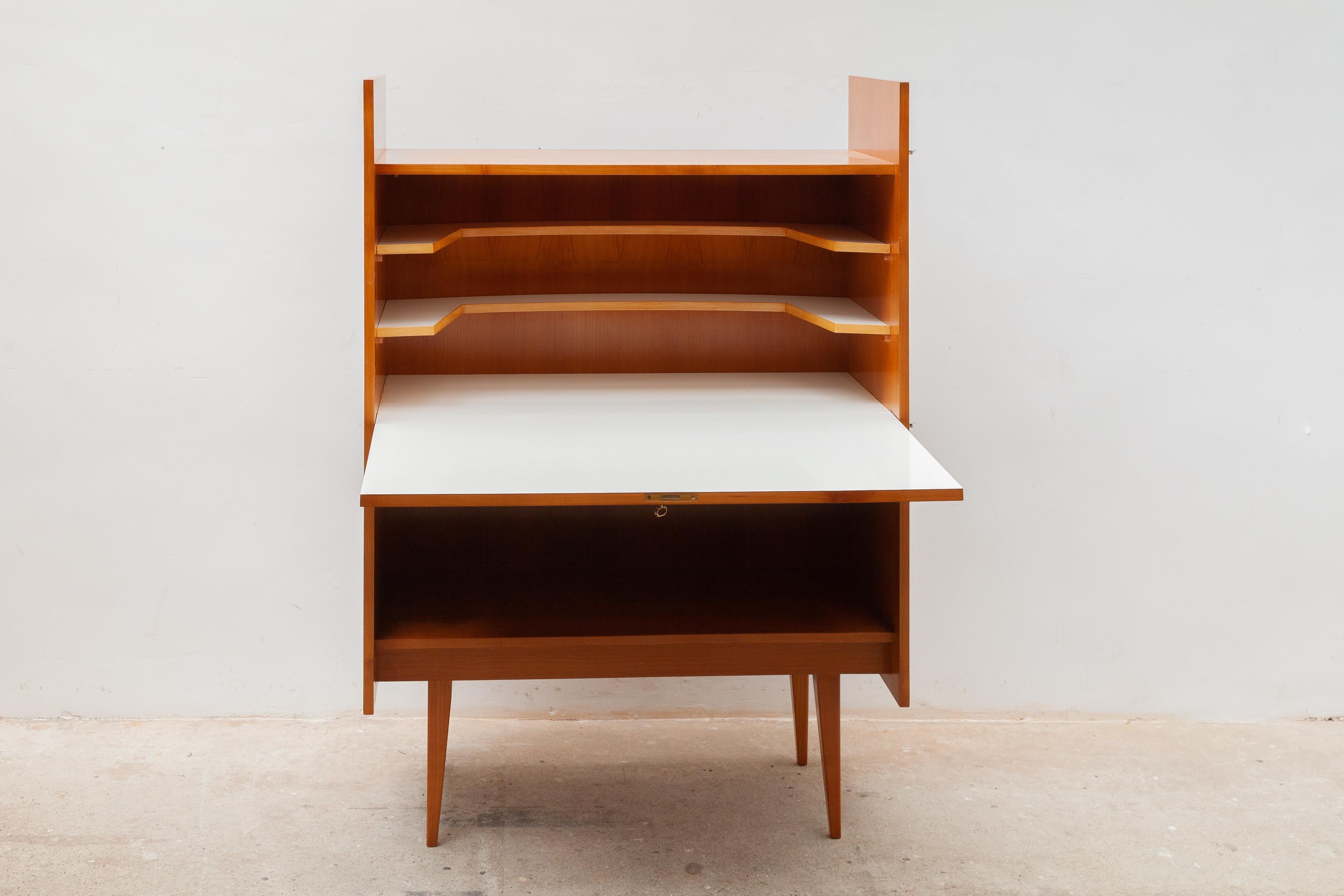 Modern beautiful sideboard in ashwood with a front door that you can open and change the furniture into a desk use with an interior with two shelves laminated in white.
Simple and sleek design that will work in any classic or modern home.