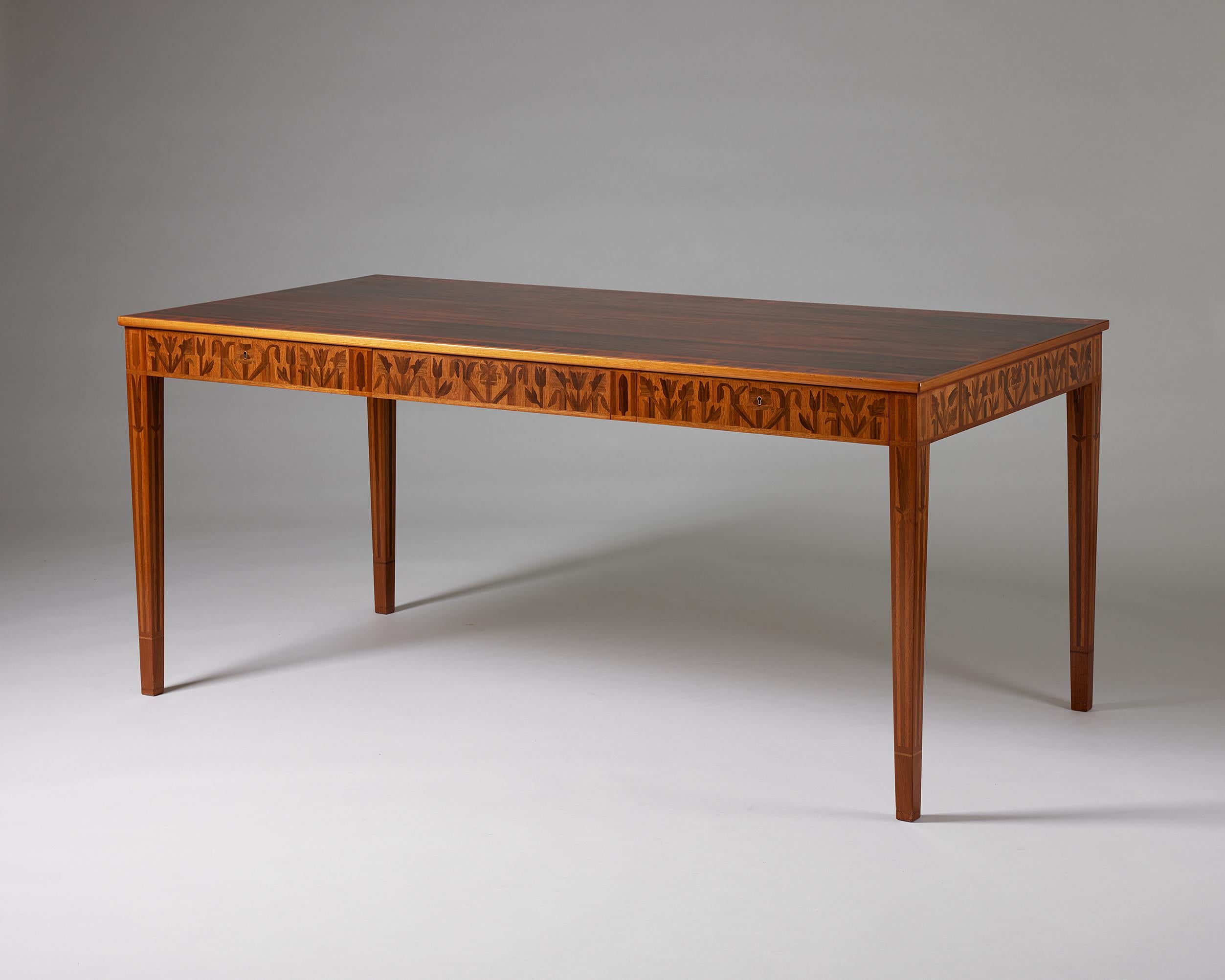 Desk ‘Ståndare’ designed by Carl Malmsten,
Sweden, 1950s-1960s.

Mahogany and exotic wood inlays.

Stamped.

A combination of intricate marquetry work and clean lines characterise this mahogany desk by Carl Malmsten from the 1950s -1960s. The