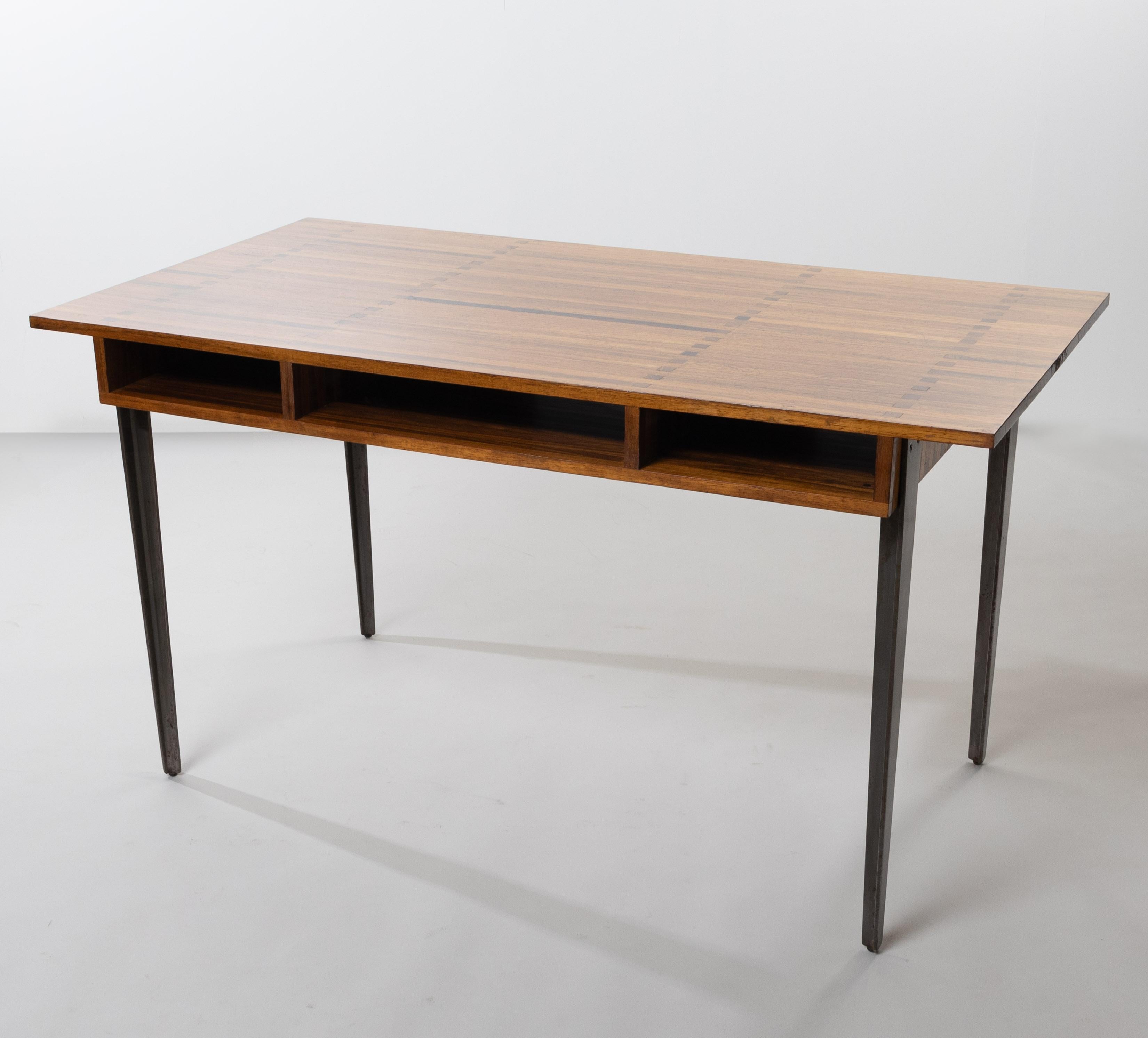 Desk table called “Gerard Philipe” by Jules Wabbes.
Solid laminated Padouk desk resting on 4 steel legs with “gun barrel” finish.
3 storage under the top.
The model takes its name from the actor Gérard Philipe (F) (Gérard Albert Philip 1922 – 1959)