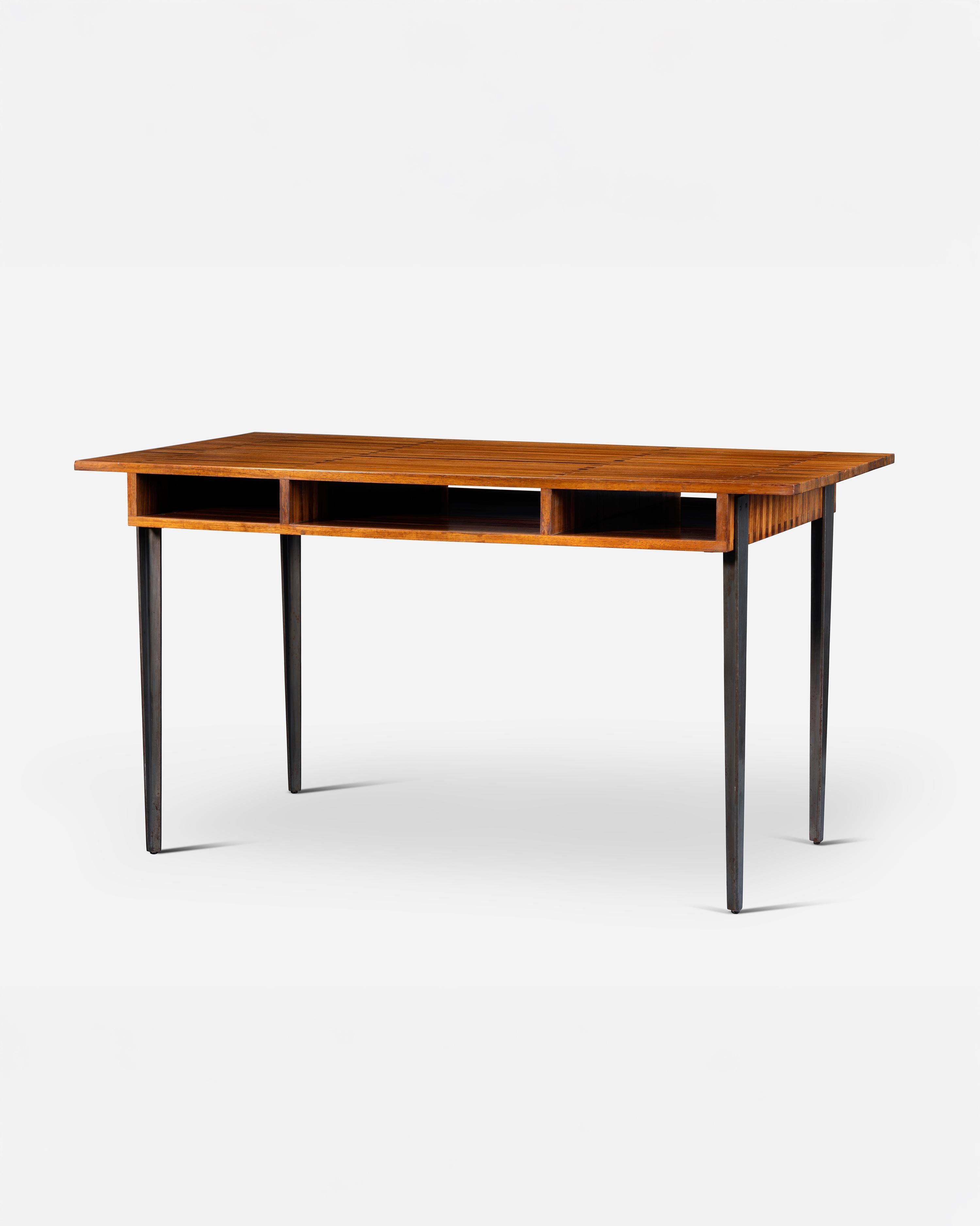 Desk table called “Gerard Philipe” by Jules Wabbes.
Solid laminated Padouk desk resting on 4 steel legs with “gun barrel” finish.
3 storage under the top.
The model takes its name from the actor Gérard Philipe (F) (Gérard Albert Philip 1922 – 1959)