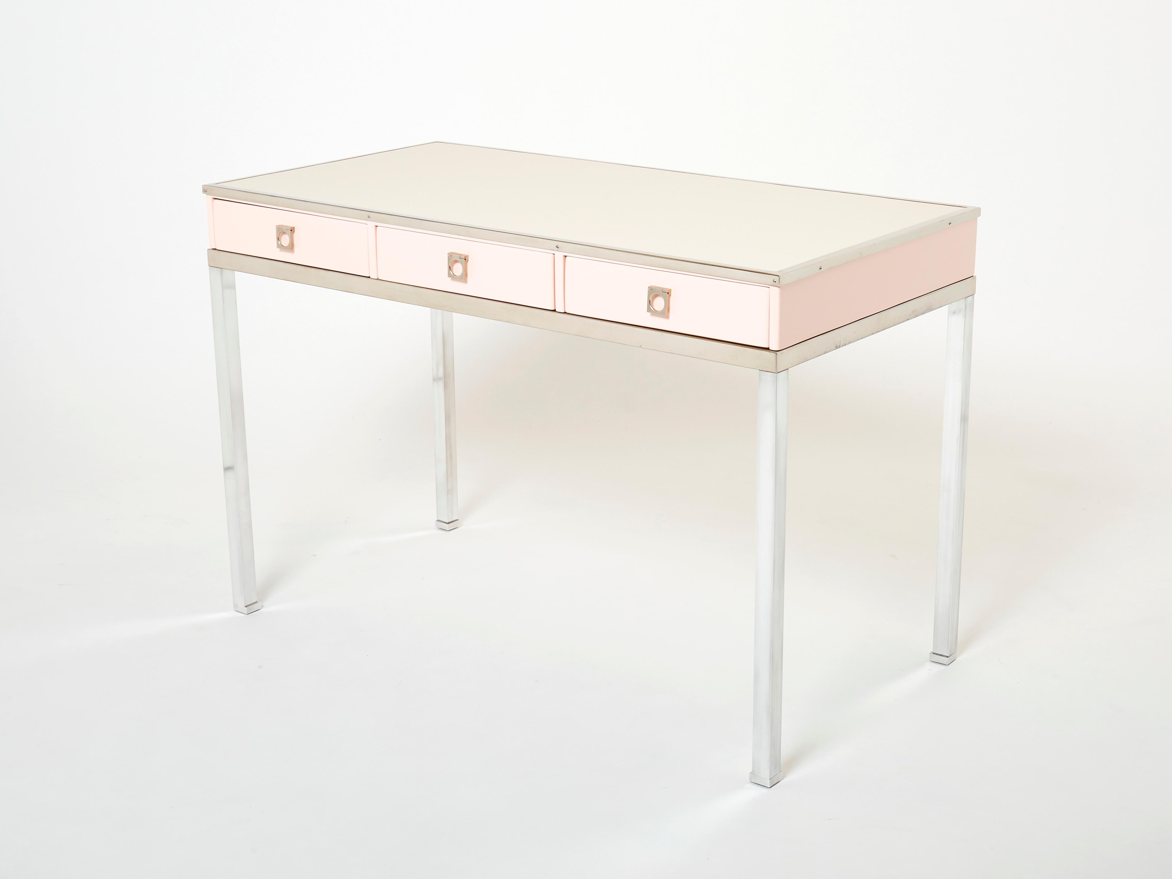 A rare Maison Jansen dusty rose lacquered desk table designed by Guy Lefevre, it features a simple side off white leatherette top surface and three drawers. Following the glamorous French Mid-century look of other classic Guy Lefevre designs, this