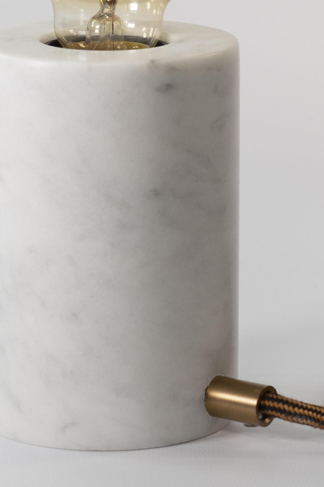 Defined by a balanced cylindrical silhouette, this modern table lamp is expertly handcrafted in Calacatta marble with a matte finish.

The piece is completed with an extra large LED bulb that enhances the elegance and uniqueness of the lamp.