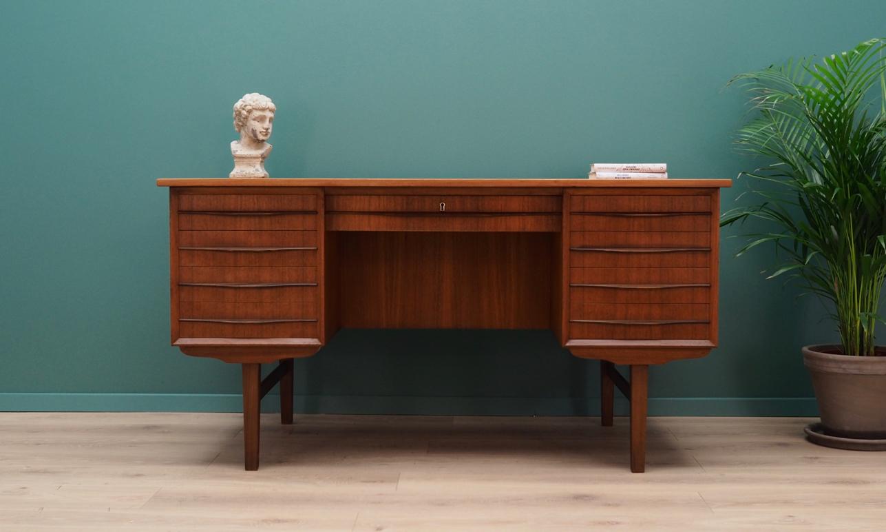 Exceptional desk from the 1960s-1970s. Scandinavian design, Minimalist form. Furniture finished with teak veneer. Desk has nine drawers (no key included) and a shelf behind a sliding door at the back. Maintained in good condition (minor bruises and