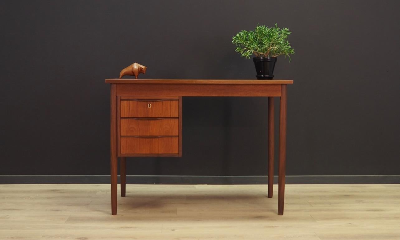 Classic desk from the 1960s-1970s, minimalistic form, Danish design. Top finished with teak veneer. Legs made of solid teak wood. Desk has three drawers. No key included. Maintained in good condition (minor bruises and scratches) - directly for