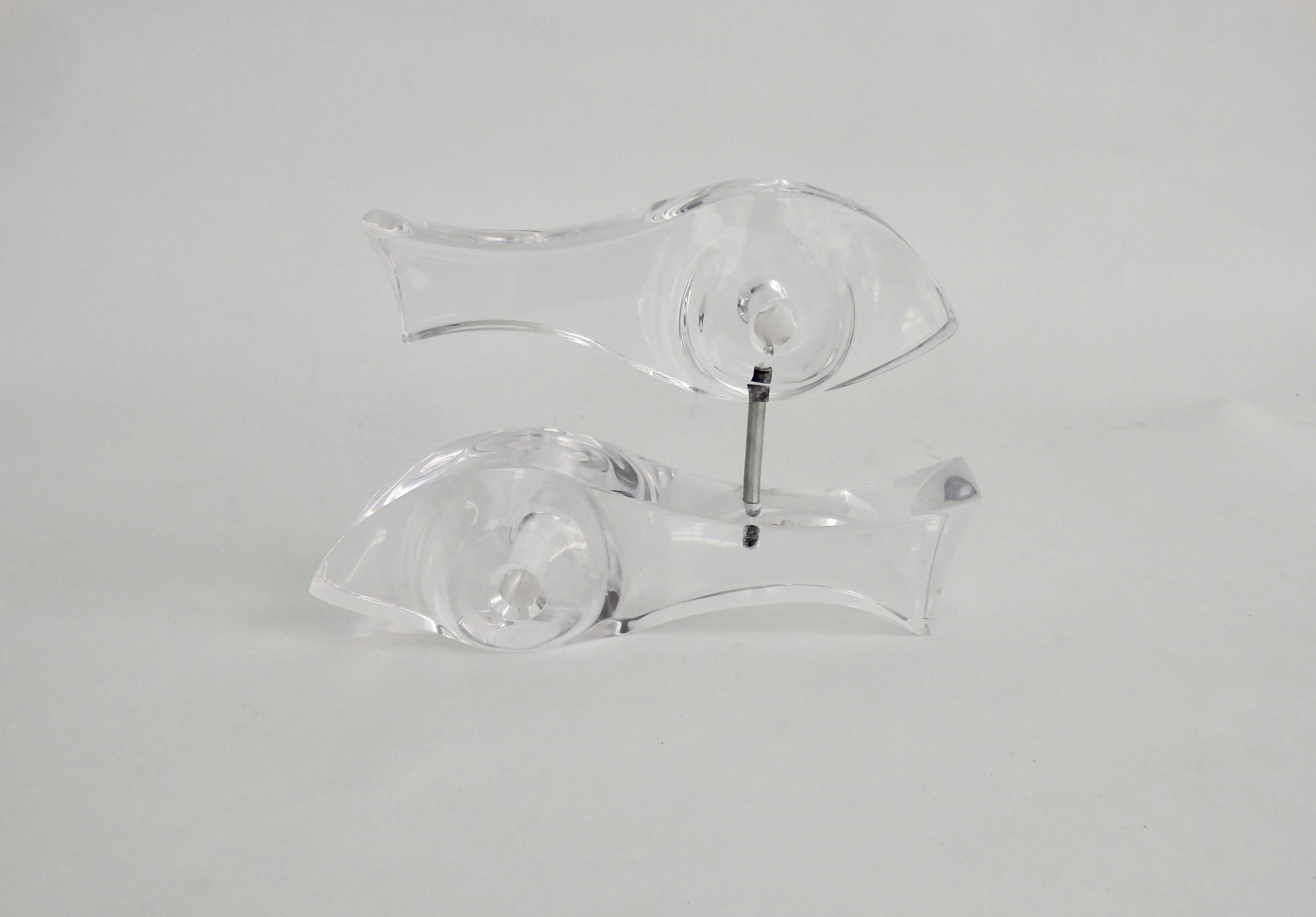 Sculpture of two lucite fish one mounted over the second with chrome dowel  connecting. 