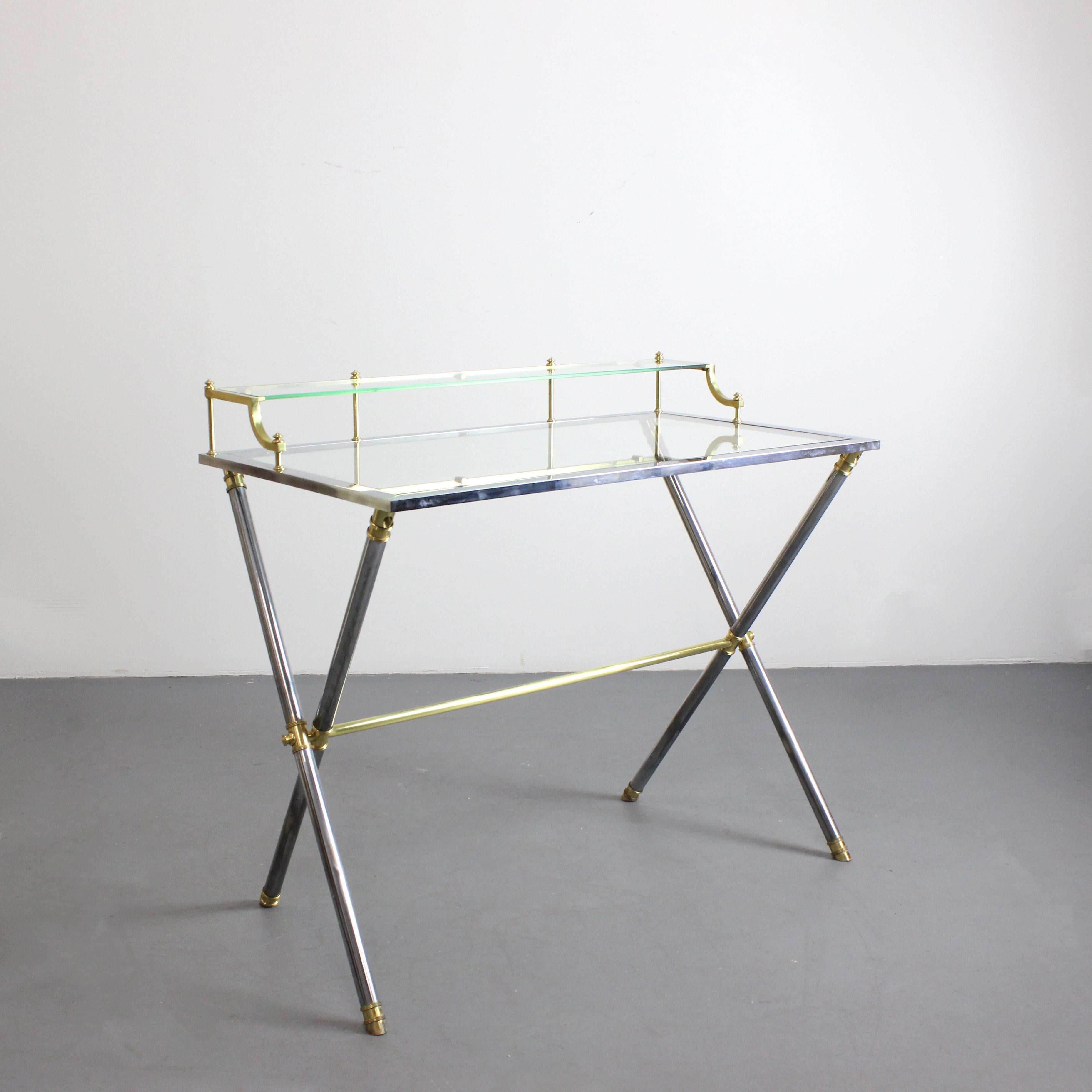 Desk with chrome-plated steel frame and gilt-plated brass details, glass top - Atr. Maison Jansen - France - c. 1960

Dimensions: 83/71 x 90 x 50 cm
