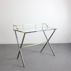 Desk with chrome-plated steel frame and gilt-plated brass details, glass top