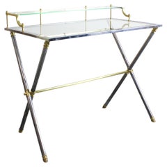 Desk with chrome-plated steel frame and gilt-plated brass details, glass top