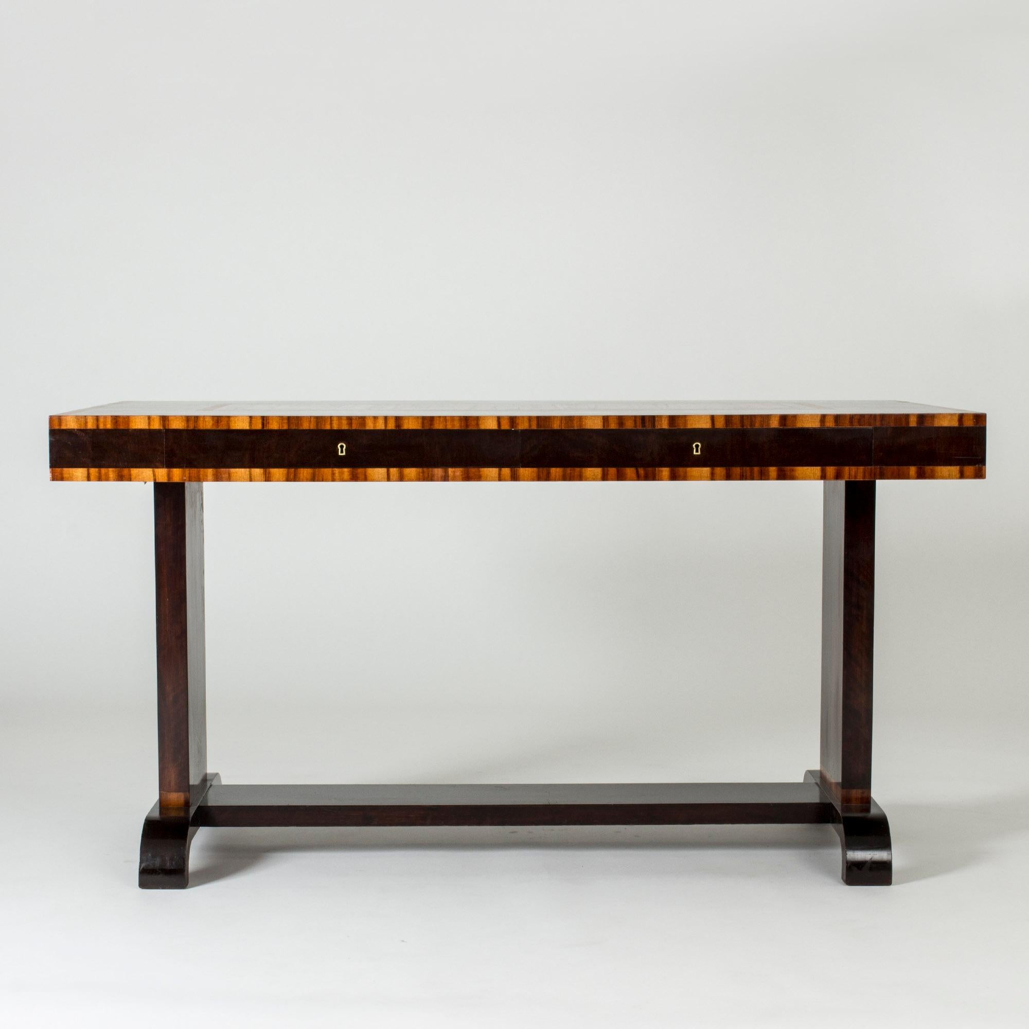 Amazing desk by Axel Larsson, made from dark stained wood with striking contrasting wood inlays with a striped pattern. Distinct functionalist design.