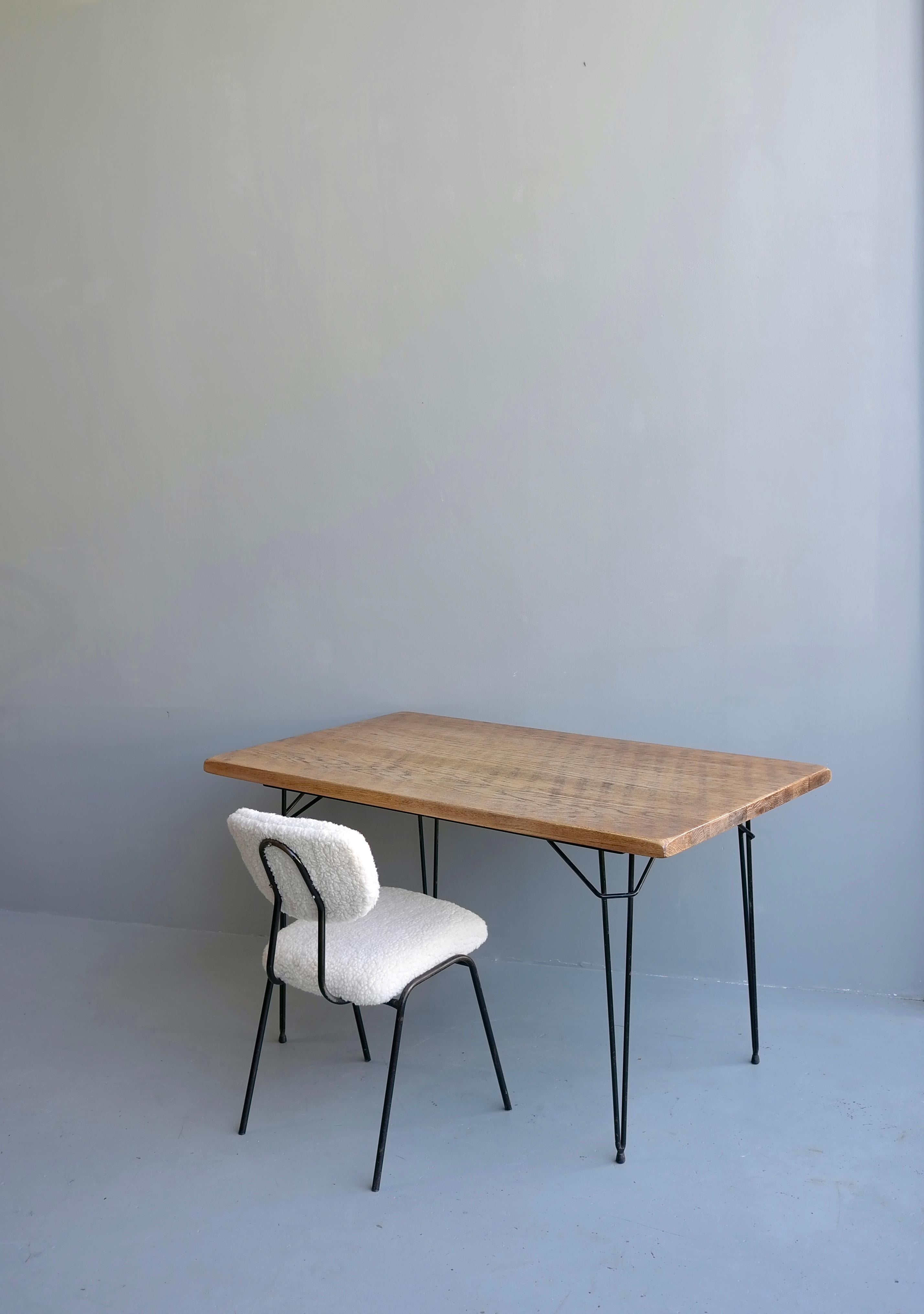 Desk with solid Oak top and steel hairpin legs with Merino wool and steel chair, 1950's.

desk size: 80cmx140cmx77,5cm

 