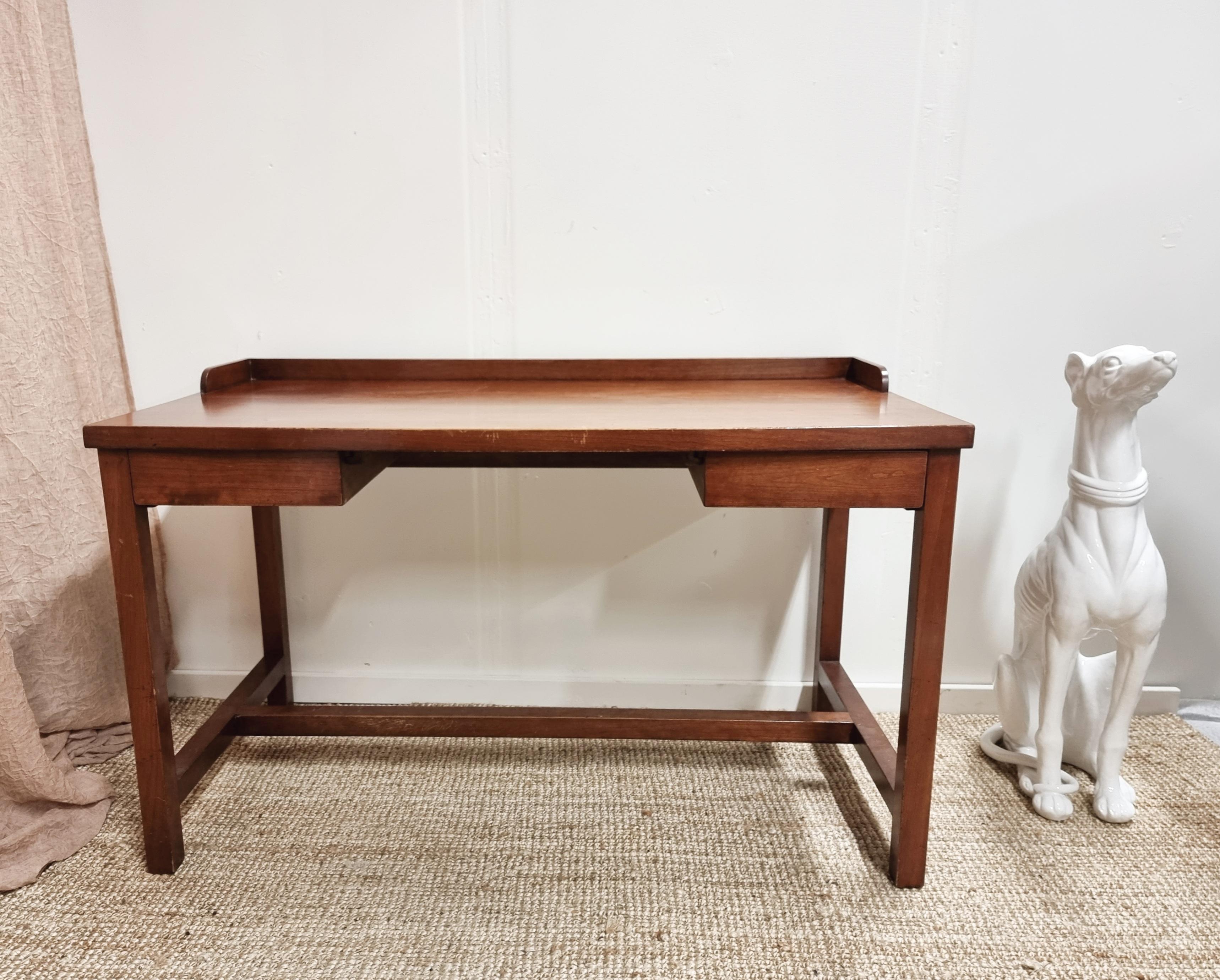 Well-crafted desk with two drawers with dovetail joints and legs attached with wooden nails. Great wrokmanship, Scandinavian Modern, mid-1900s.

The desk is beautiful from all sides. Nice patina and stabile construction, signs of normal wear,