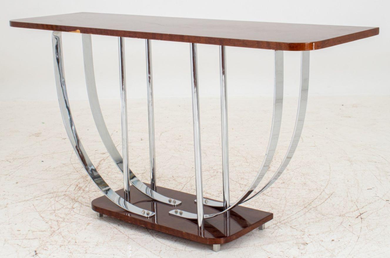 Donald Deskey (American, 1894-1989) Attributed Art Deco Mahogany and Chrome Console Table, with a rounded rectangular top supported by chrome arches and columns, on a conforming base with square steel feet. 32
