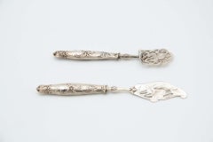 Dessert service with silver handles