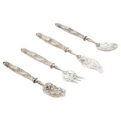 Dessert service with silver handles