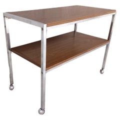 Desserte / table basse vintage sur roulettes en bois et métal chromé années 70