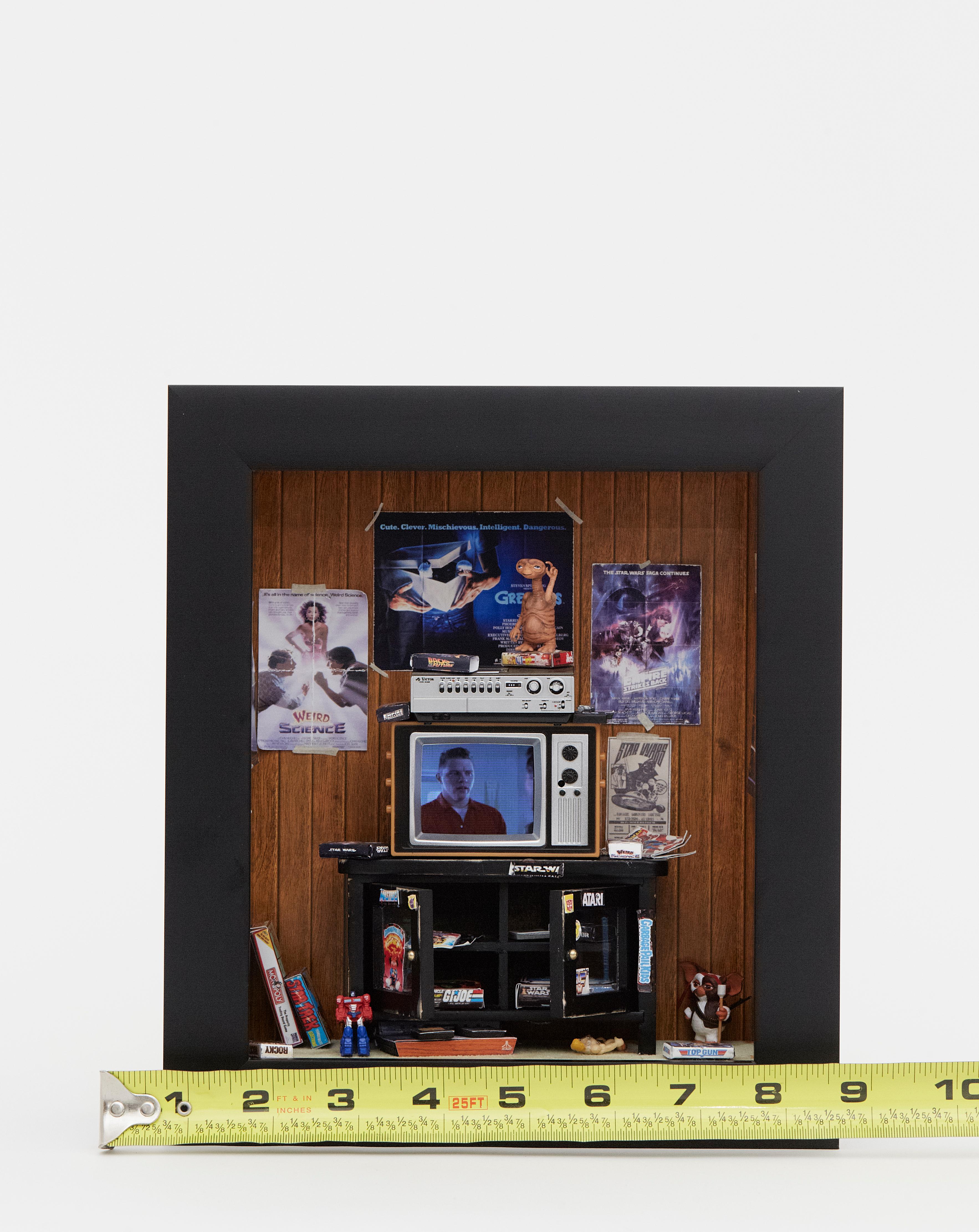 MINIATURE GEN X ROOM CASE STUDY -001-PG-13
Transport yourself back to 1988 with this handmade room box featuring:
-Working T.V. w remote playing movie clips from Back to the Future (licensed by Universal)
-Handmade 80's movie posters. Distressed by