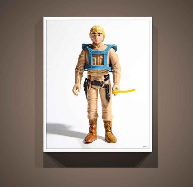 This is a pop art photo print of the original Luke Skywalker toy from Kenner.
 
