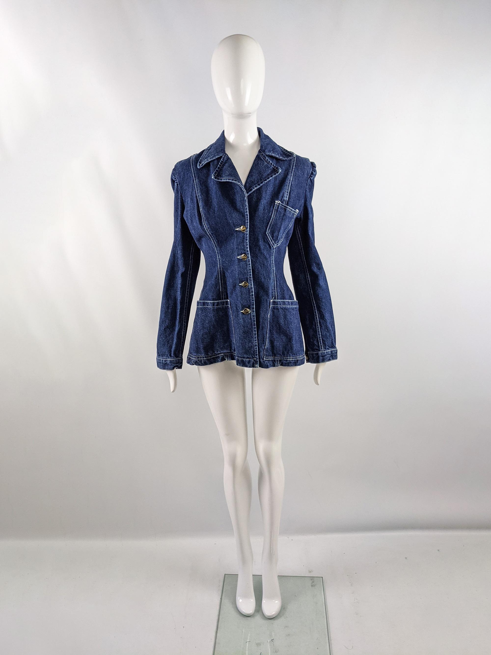 An excellent vintage womens denim jacket from the 90s by luxury British fashion designer, John Richmond for his cult label, Destroy. In a dark blue denim with a tailored, nipped waist which gives an hourglass silhouette and a 70s style collar.