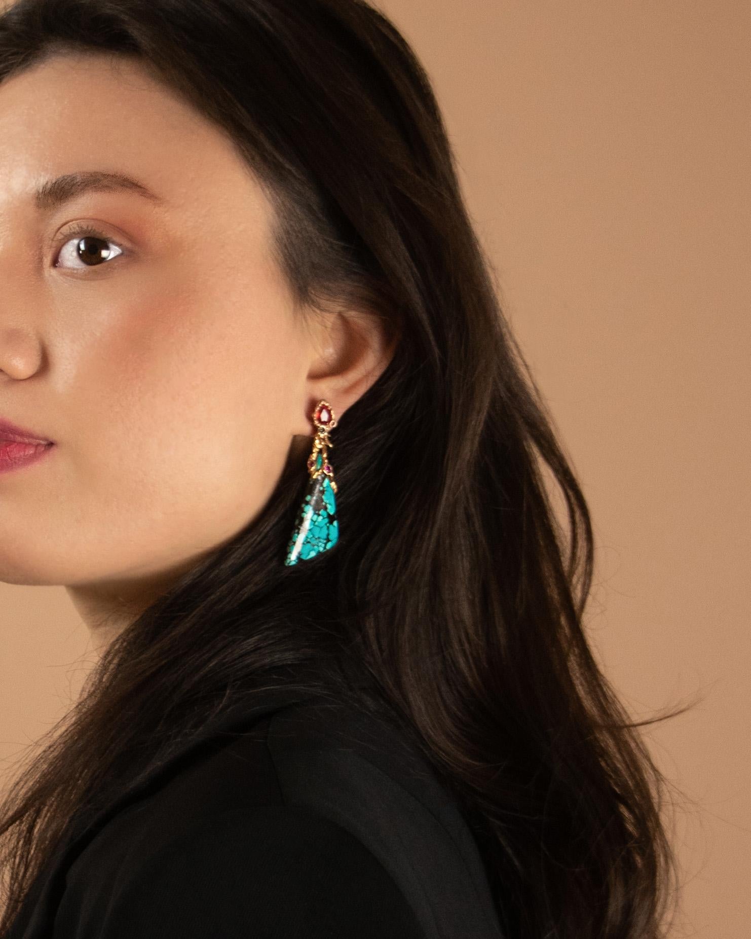 These Lava detachable earrings are inspired by the volcanic eruption in Plato's story of Atlantis. Crafted from 18K Rose Gold, they are embellished with spider-web Turquoise freeform cabochons, pear-shape faceted Orange Sapphires, round faceted