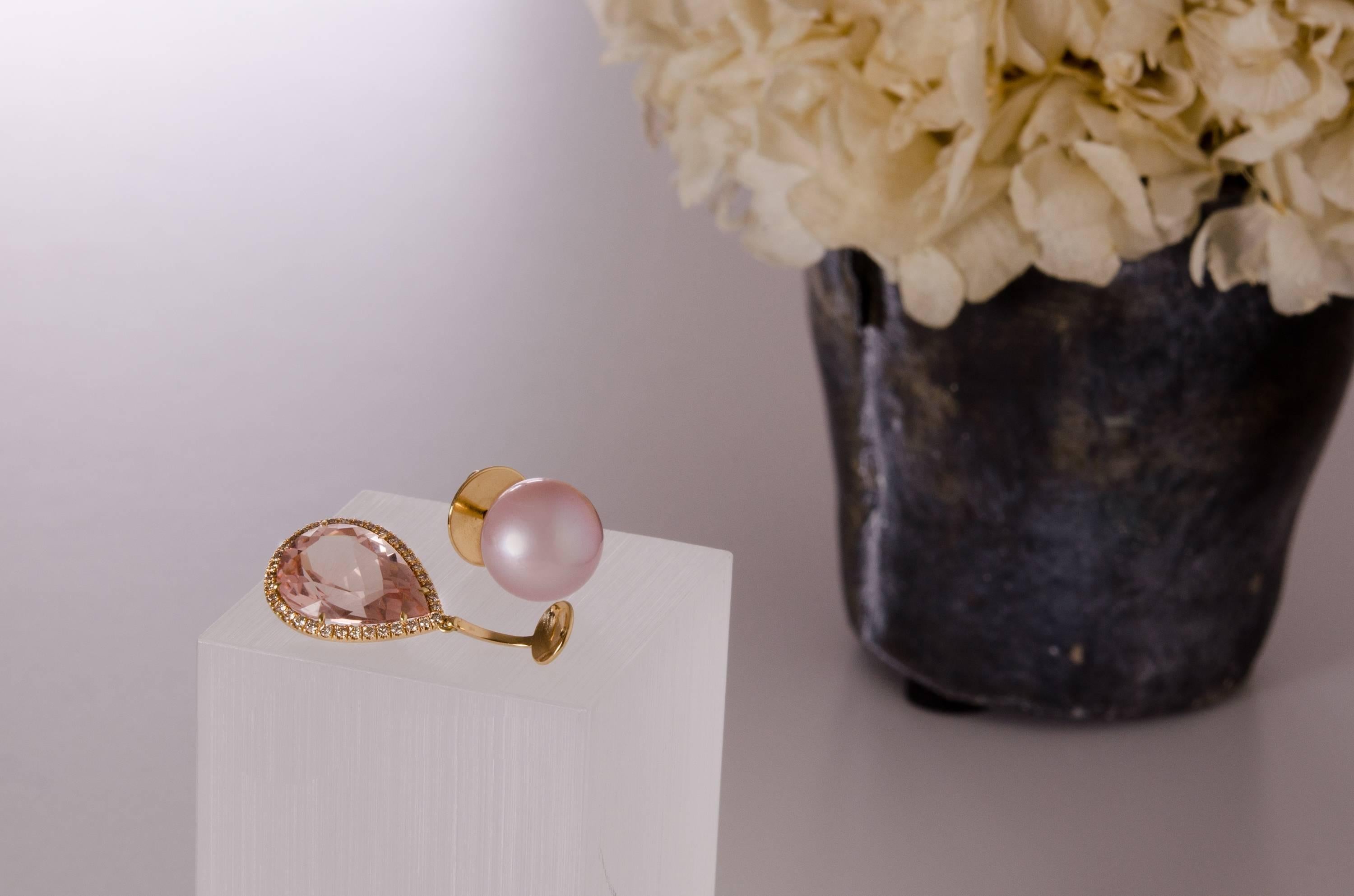These one-off earrings are handmade in Switzerland. The earrings are made in 18K rose gold (4N) with two pink freshwater pearls (11.7mm) and detachable pear shaped Morganites of together 12.36 ct. in entourage of 70 8/8 Swiss cut champagne Diamonds