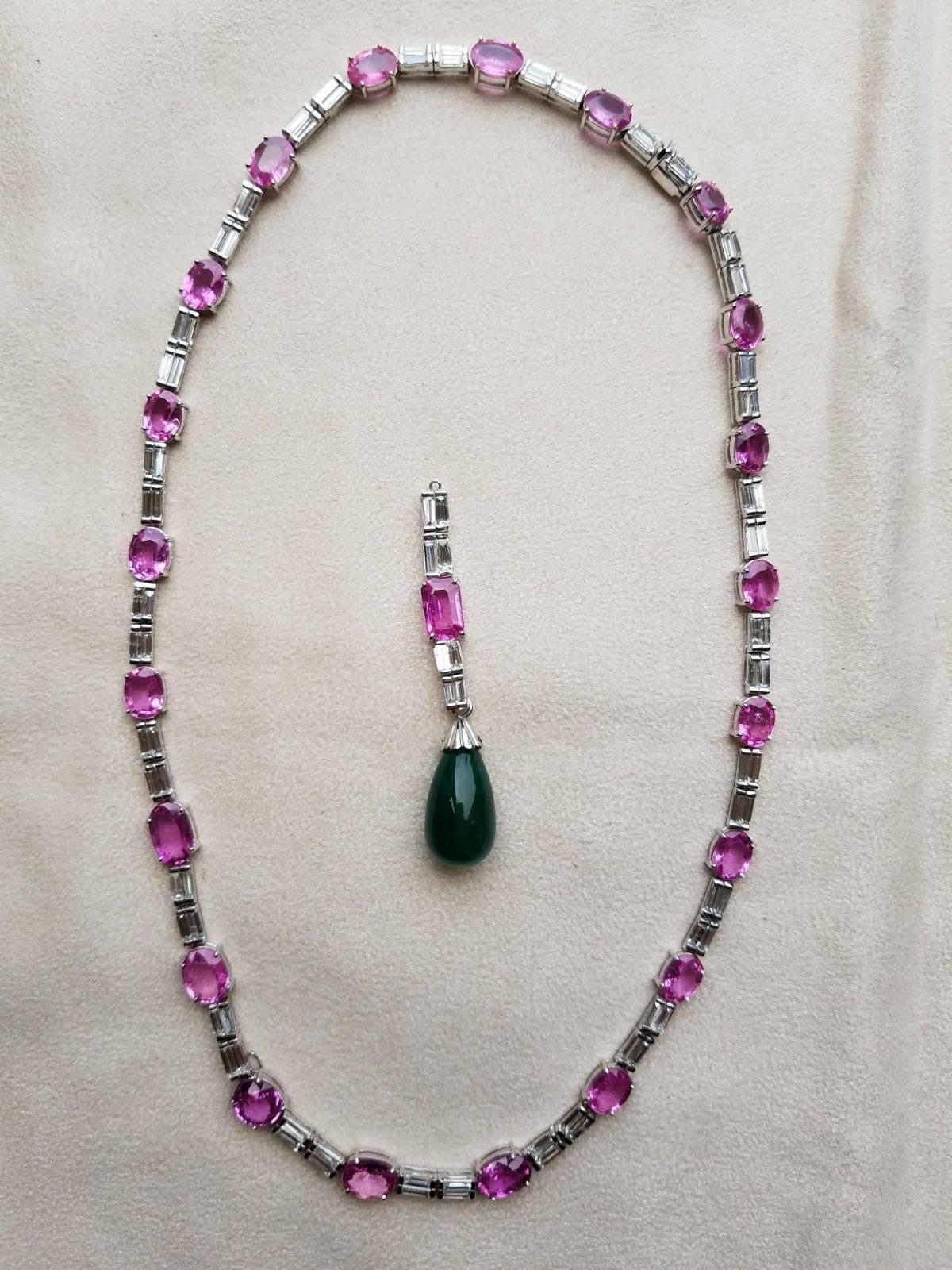 A classic Pink Sapphire and Diamond baguette necklace, with a detachable hanging Emerald drop locket - all set in 18K white gold. 

Stone Details:
Pink Sapphire - 34.96 carats
Zambian Emerald Drop - 17.22 carats
Diamond - 8.8 carats , VS/H,I

The