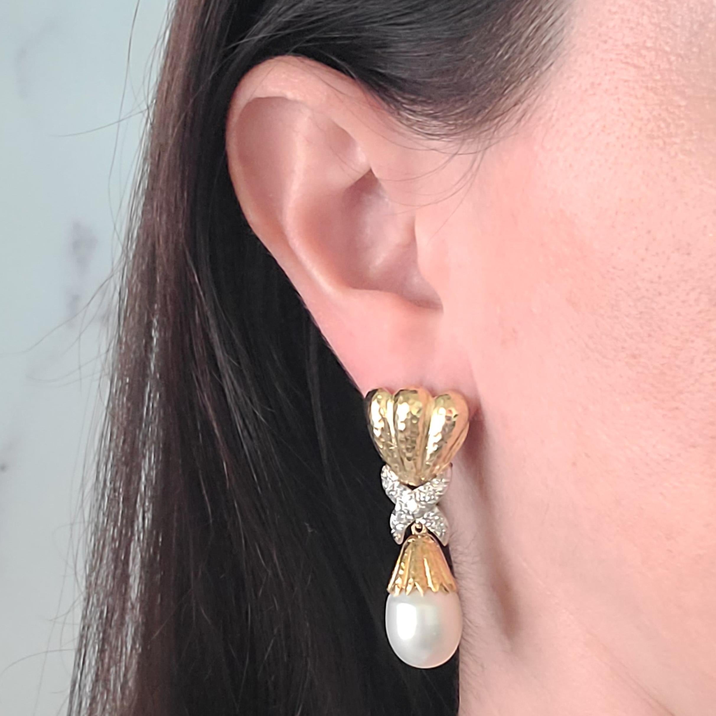 18 Karat Yellow Gold Removable Pearl Drop Earrings Featuring 2 South Sea Cultured White Pearls Measuring 12.6mm. Hammered Design With 18 Round Diamond Accents Of VS Clarity and G Color Total Approximately 0.60 Carats. 2 Inches Long With Pierced Post