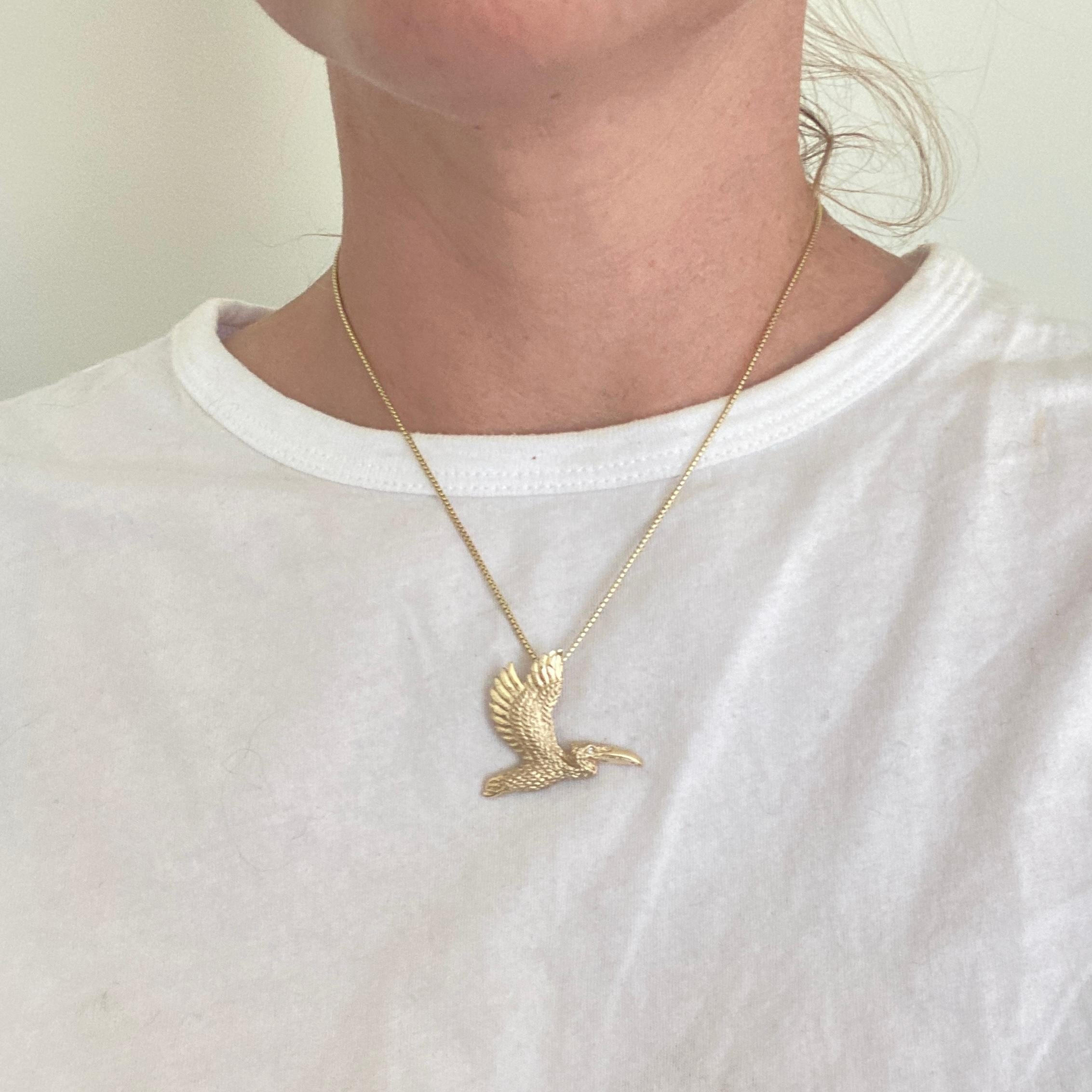 Detailed 14K Yellow Gold Pelican Pendant Necklace with Diamond Eye by Ashley Childs

Cicada originally carved by 