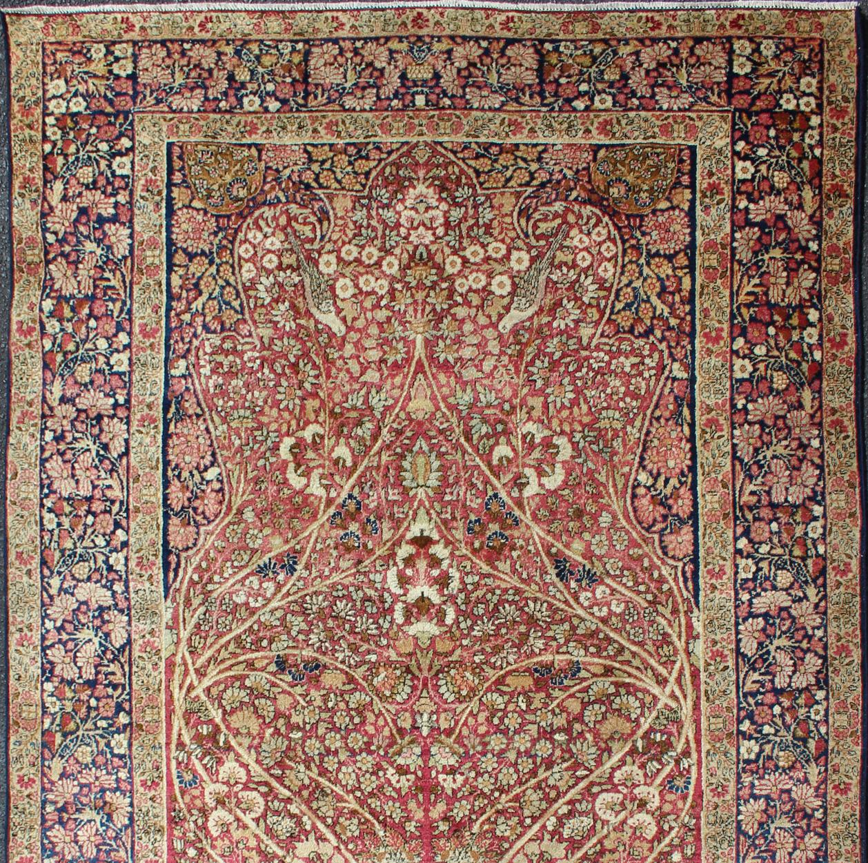 Ornately detailed antique Persian Lavar Kerman rug replicating trees, branches and birds in a forest Design, rug KBE-200205, country of origin / type: Iran / Lavar Kerman, circa 1900.

This Lovely antique Persian Lavar Kerman rug features an ornate