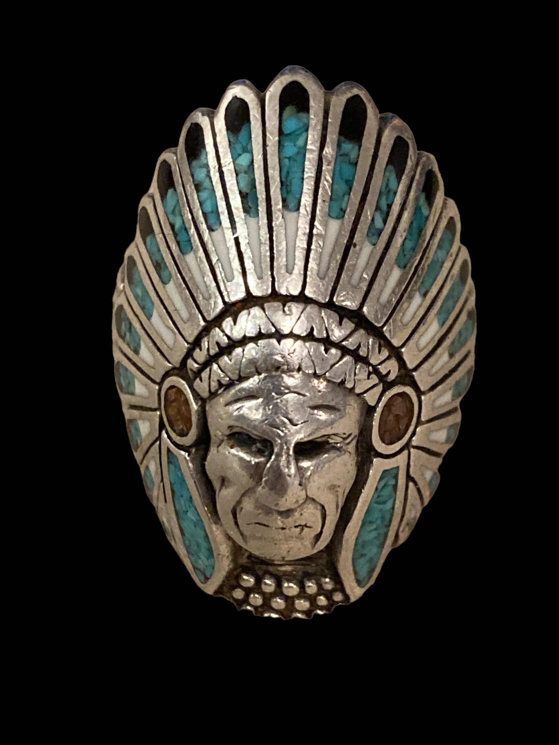 This Navajo Native American Indian Chief Sterling Silver Turquoise Ring boasts incredible detail all around, but the face tells the whole story. I see rings of this type on a weekly basis but hadn't before seen one as proud, brave and poignant as