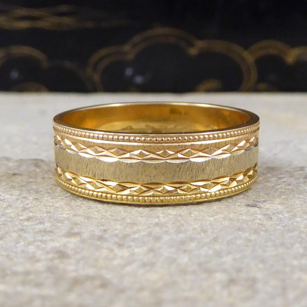 A great quality contemporary wide band measuring 6mm in width allowing room for intricate detailing and a strip of white gold circling the middle of the band. This band could be worn as a wedding ring consisting of three different golds, Rose, White