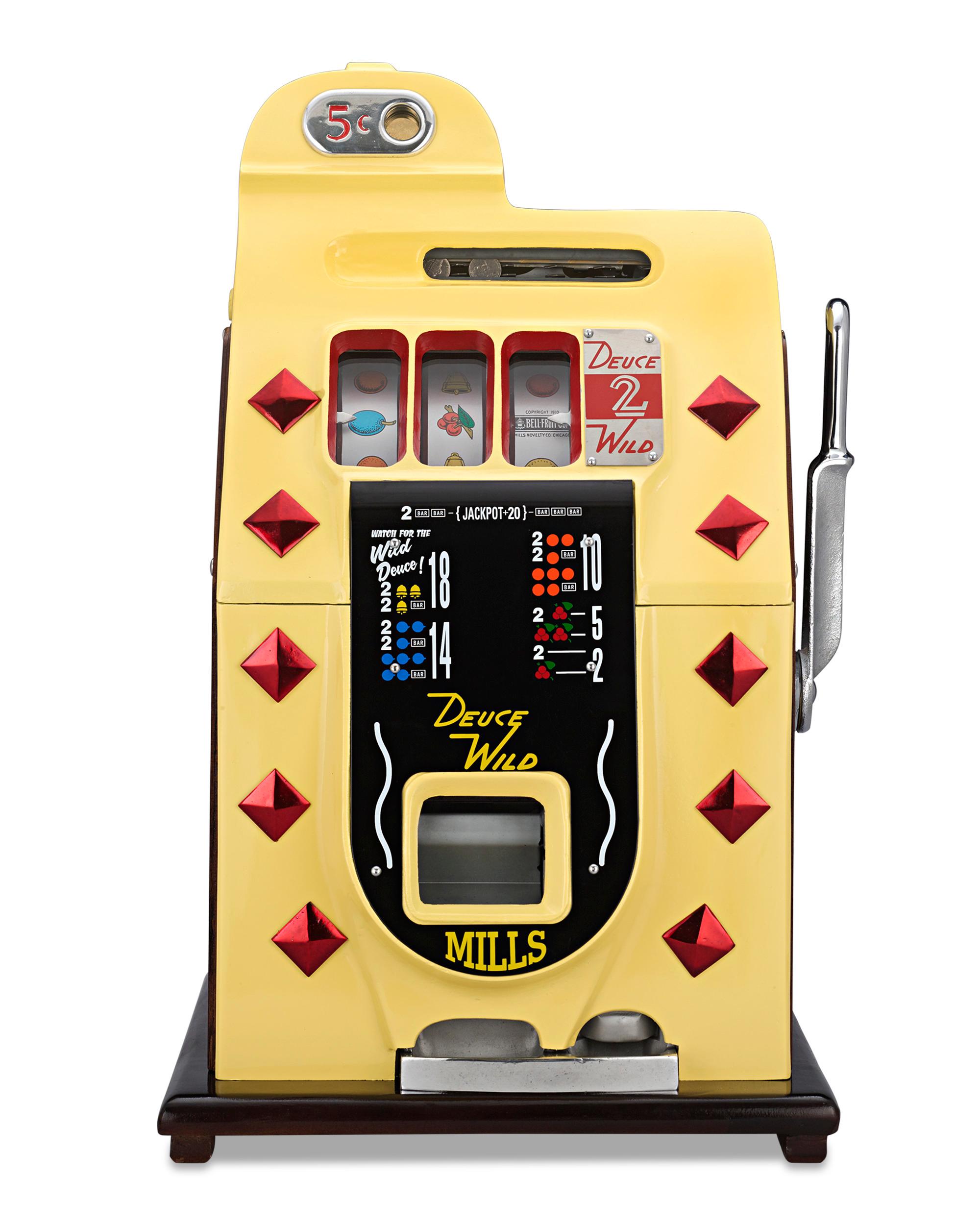 This nostalgic 5-cent Deuces Wild diamond-front slot machine built by the Mills Novelty Company of Chicago, the leader of the slot machine movement in the United States. Crafted from cast iron, the brilliantly colored machine is decorated in an