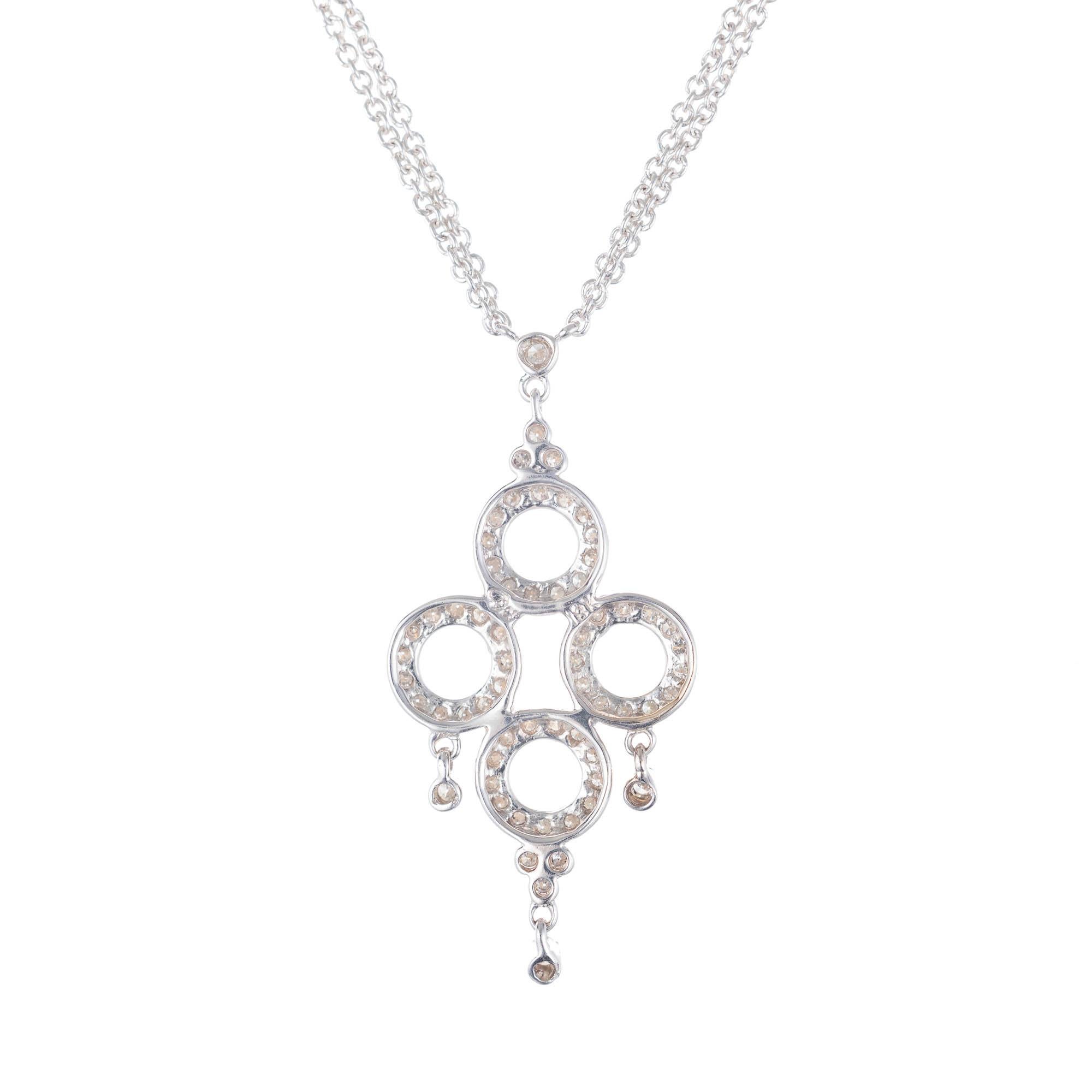 Dev Valencia diamond four circle pendant with an 18k white gold with 16 Inch double chain. 

62 round H-I SI diamonds, Approximate .32 carats 
Chain: 16 Inch Double Chain 
18k White Gold 
Stamped: 18k 750
Hallmark: Dee Valencia 
Top to Bottom: