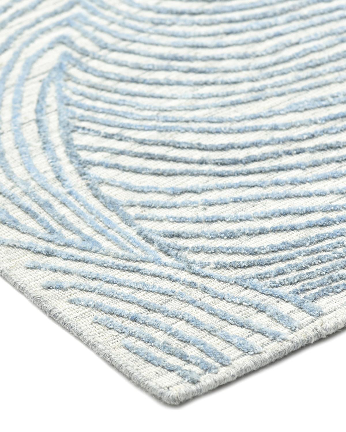 The rugs of the Modern collection can invigorate a traditional room as gracefully as it can ground a more contemporary space. Each rug is painstakingly handcrafted by artisans in India using time-honored techniques.